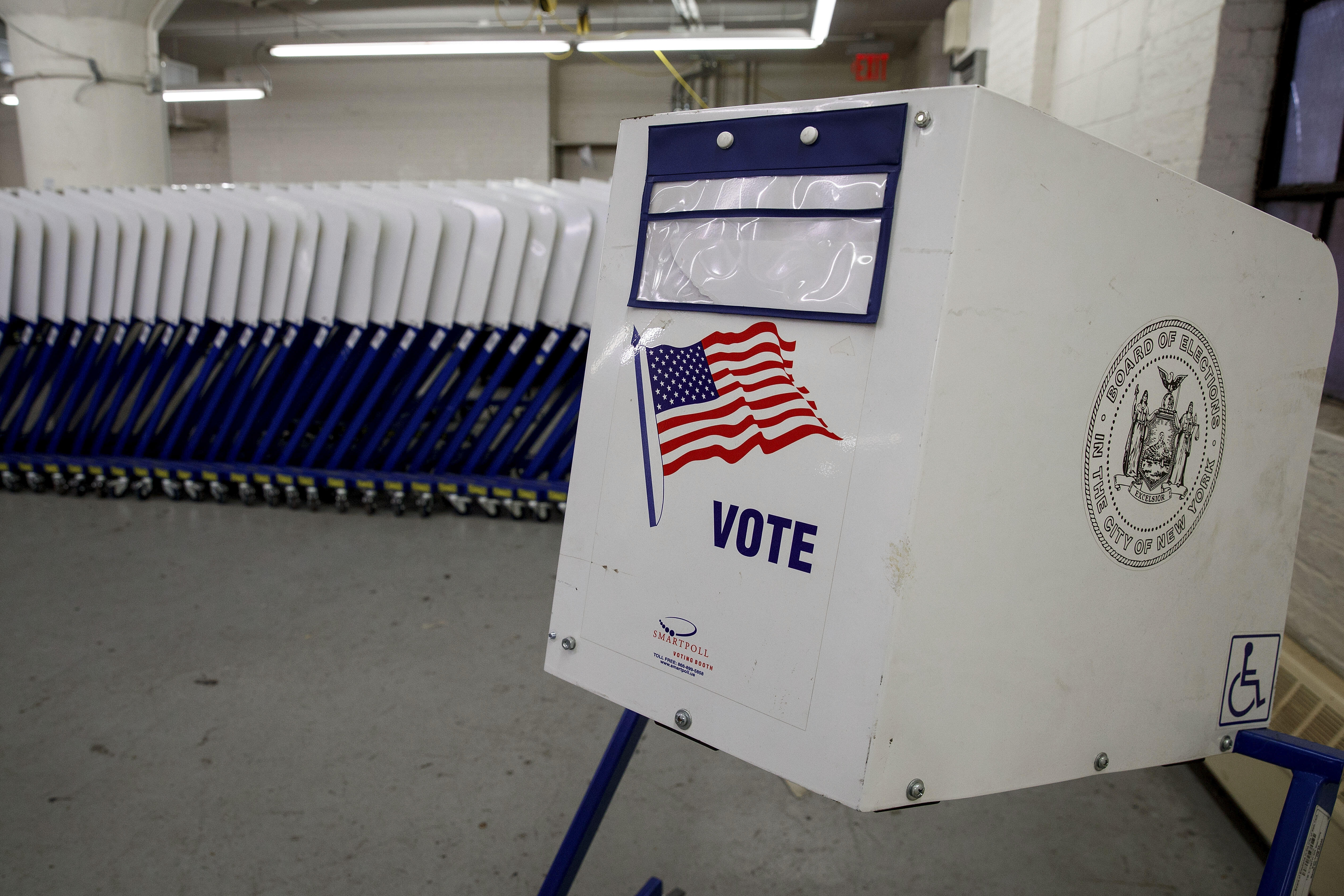 NEW YORK, NY - NOVEMBER 3:  Voting booths sit at a New York City Board of Elections voting machine facility warehouse, November 3, 2016 in the Bronx borough in New York City. The voting booths, ballot scanners and other supplies will be picked up on Monday and delivered to area Bronx polling places ahead of Tuesday's election. (Photo by Drew Angerer/Getty Images)