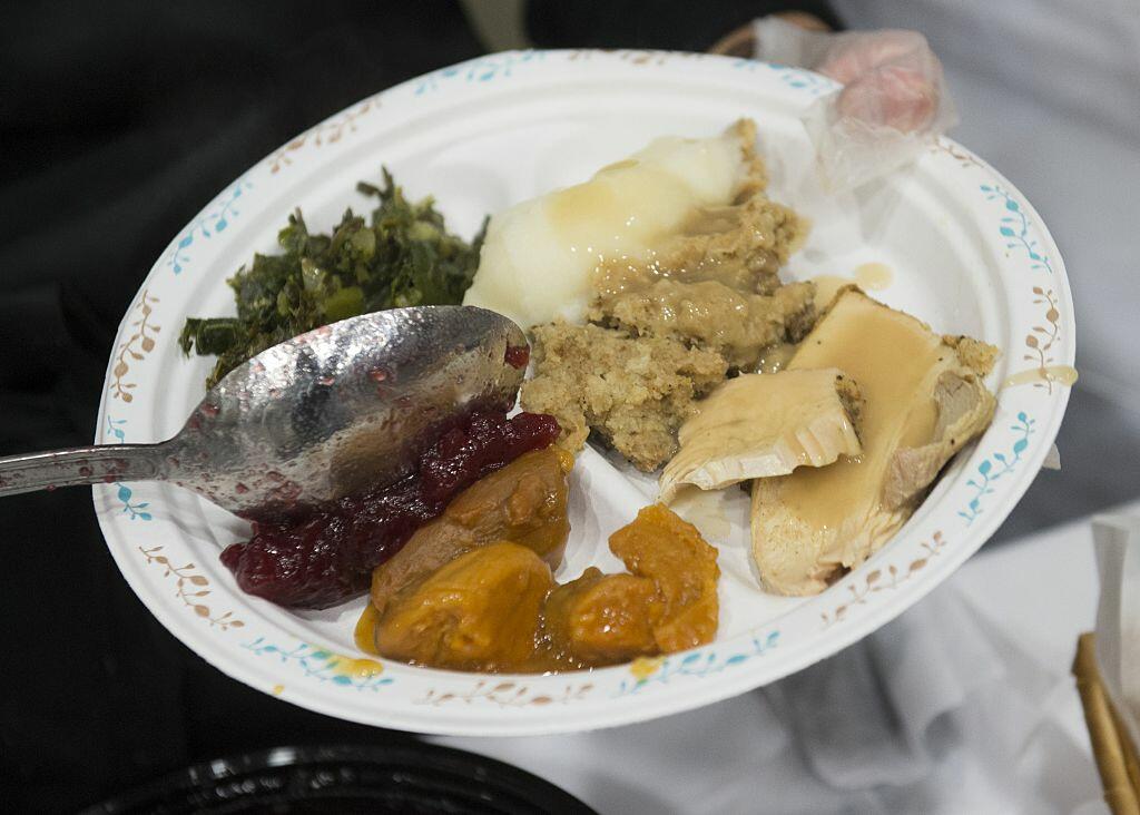 Volunteers serve a traditional Thanksgiving meal during  the 