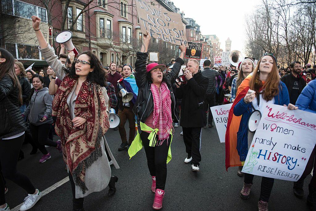 Protesters march across Boston Commons during the Boston Women's March for America on January 21, 2017.  Led by women in pink 