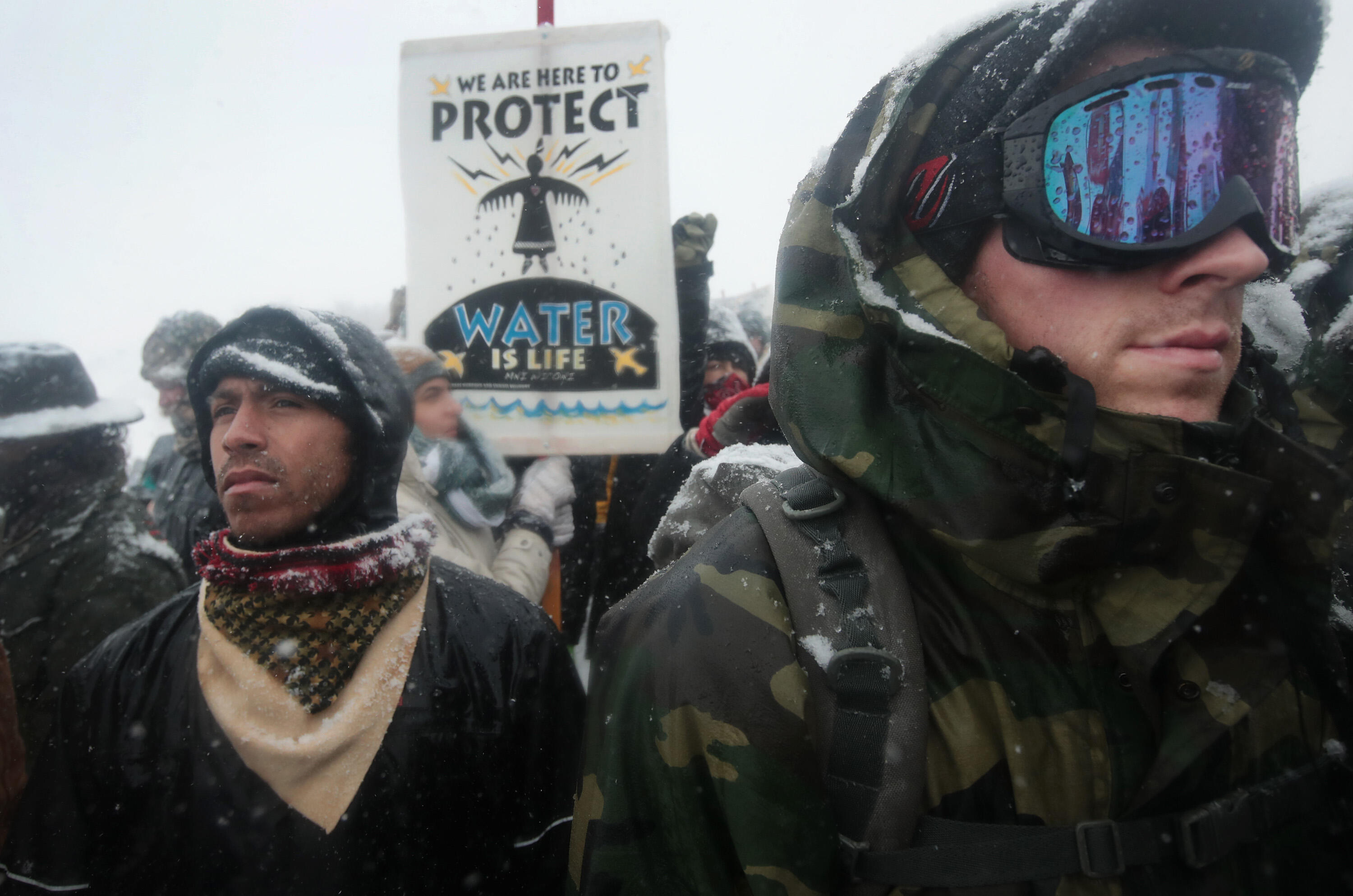 CANNON BALL, ND - DECEMBER 05:  Despite blizzard conditions, military veterans march in support of the 