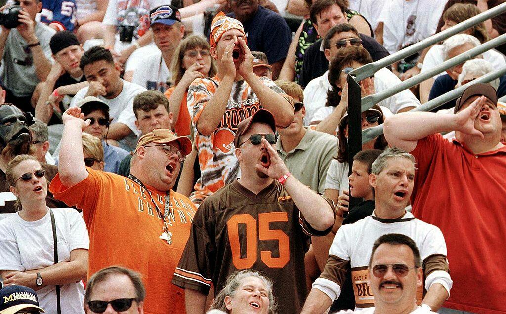 CANTON, :  Cleveland Browns fans in the crowd during the introduction of enshrinee and former Cleveland Brown player Ozzie Newsome boo at the mention of former Browns' owner Art Modell during the Hall of Fame Induction ceremony 07 August 1999 at the Pro F