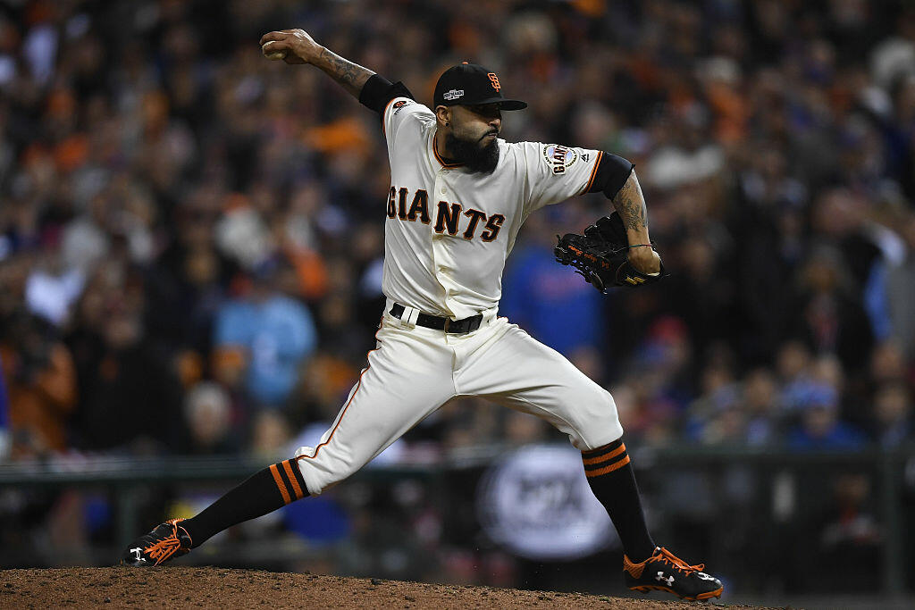SAN FRANCISCO, CA - OCTOBER 10:  Sergio Romo #54 of the San Francisco Giants delivers a pitch in the ninth inning against the Chicago Cubs during Game Three of their National League Division Series against the Chicago Cubs at AT&T Park on October 10, 2016 in San Francisco, California.  (Photo by Thearon W. Henderson/Getty Images)
