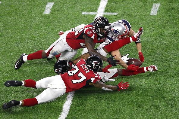 HOUSTON, TX - FEBRUARY 05:  Julian Edelman #11 of the New England Patriots makes a 23 yard catch in the fourth quarter against Ricardo Allen #37, Robert Alford #23 and Keanu Neal #22 of the Atlanta Falcons during Super Bowl 51 at NRG Stadium on February 5, 2017 in Houston, Texas.  (Photo by Ezra Shaw/Getty Images)