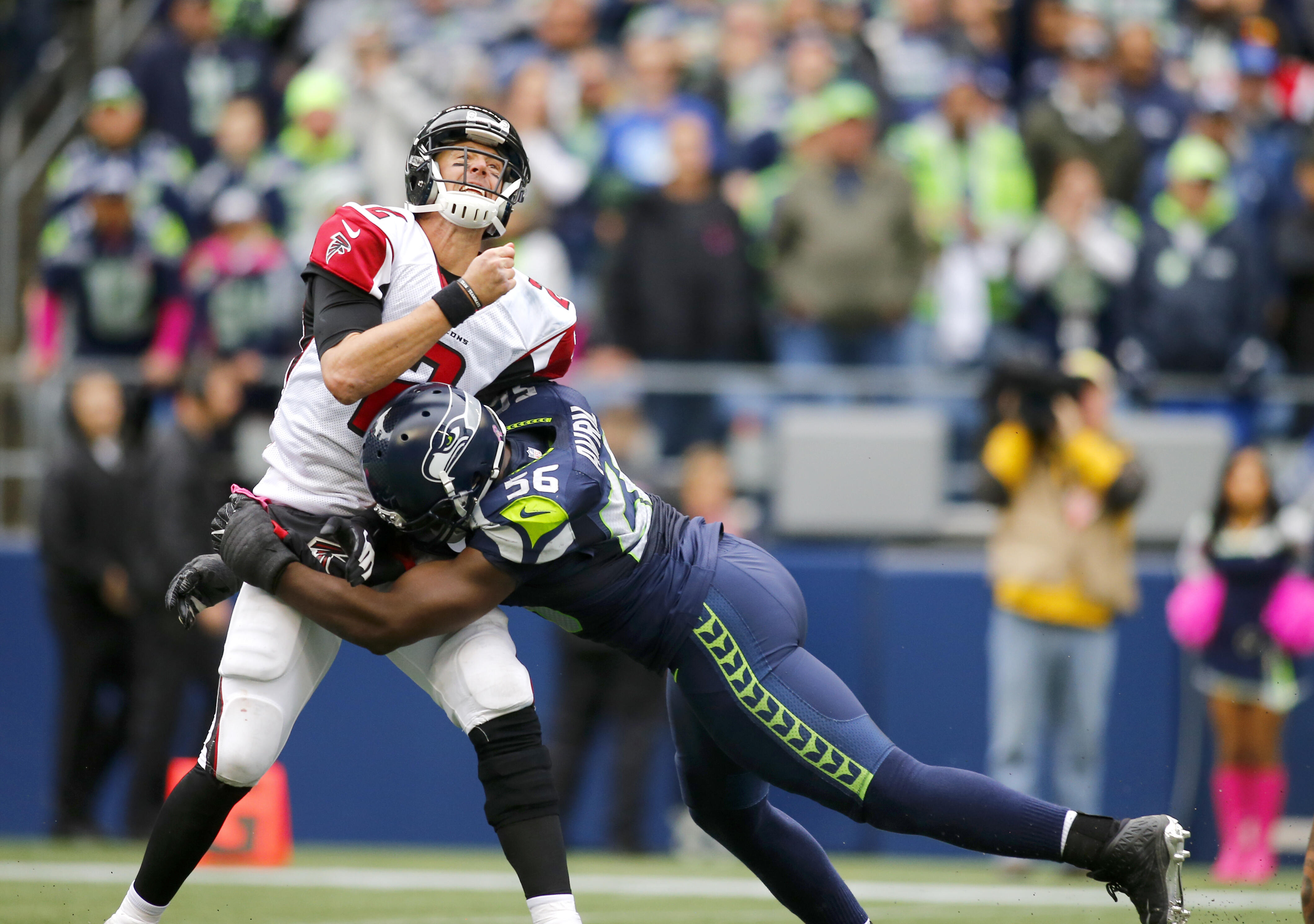 SEATTLE, WA - OCTOBER 16:  Quarterback Matt Ryan #2 of the Atlanta Falcons is hit by defensive end Cliff Avril #56 of the Seattle Seahawks at CenturyLink Field on October 16, 2016 in Seattle, Washington.  (Photo by Jonathan Ferrey/Getty Images)