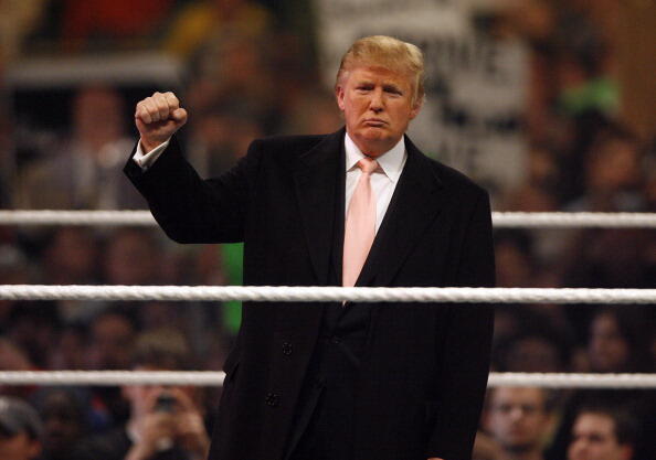 Donald Trump gets the crowd pumped up prior to the start of the WrestleMania 23 at Detroit's Ford Field in Detroit, Michigan on April 1, 2007. (Photo by Leon Halip/WireImage)
