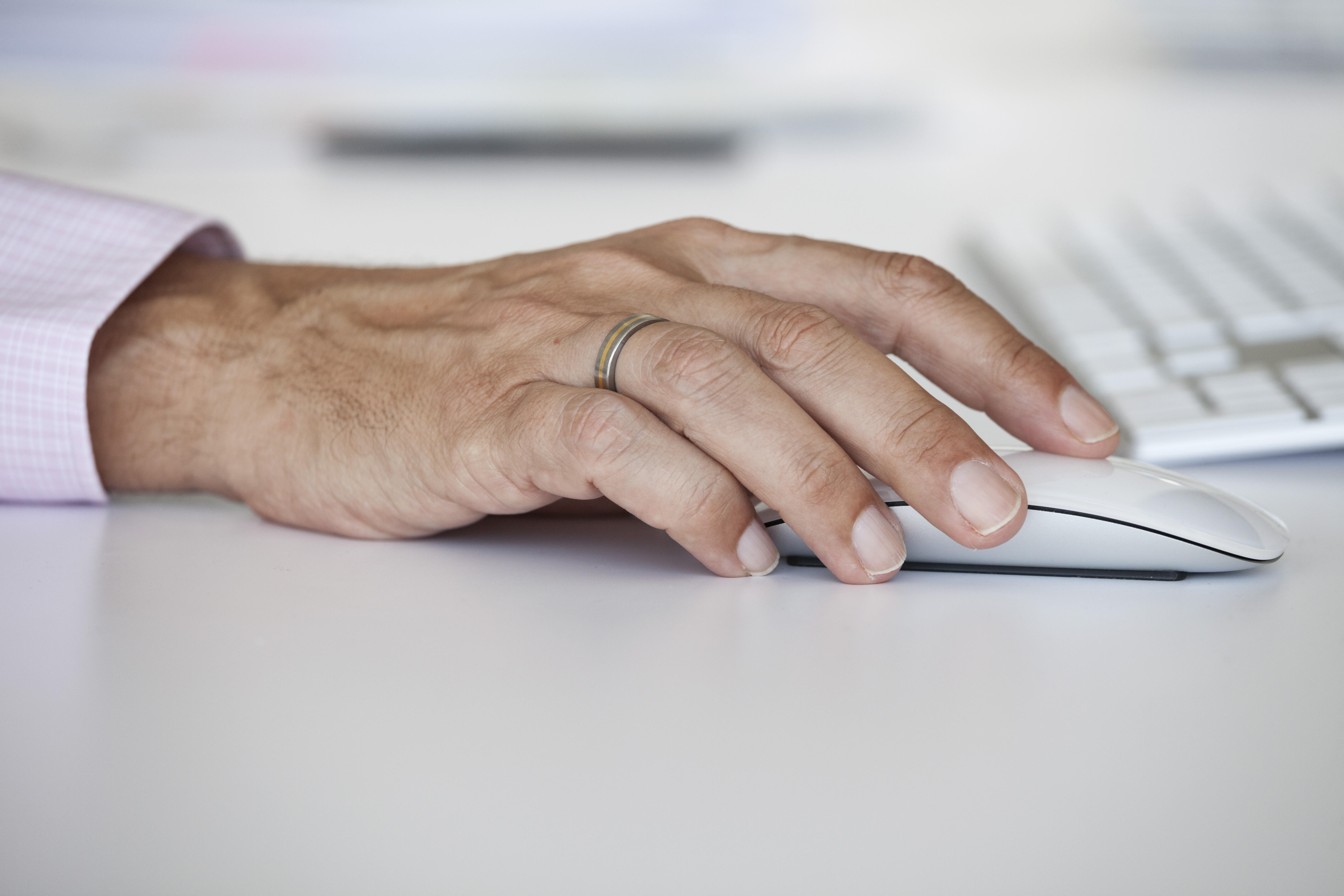 Man's hand on a computer mouse