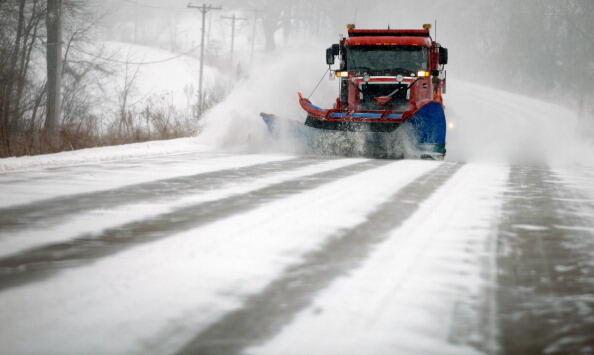 IOWA CITY, IA - FEBRUARY 01:  A snow plow truck clears suburban roads as the wind picks up and snow begins to fall February 1, 2011 in Iowa City, United States. The National Weather Service has warned that the coming winter storm will produce blizzard con