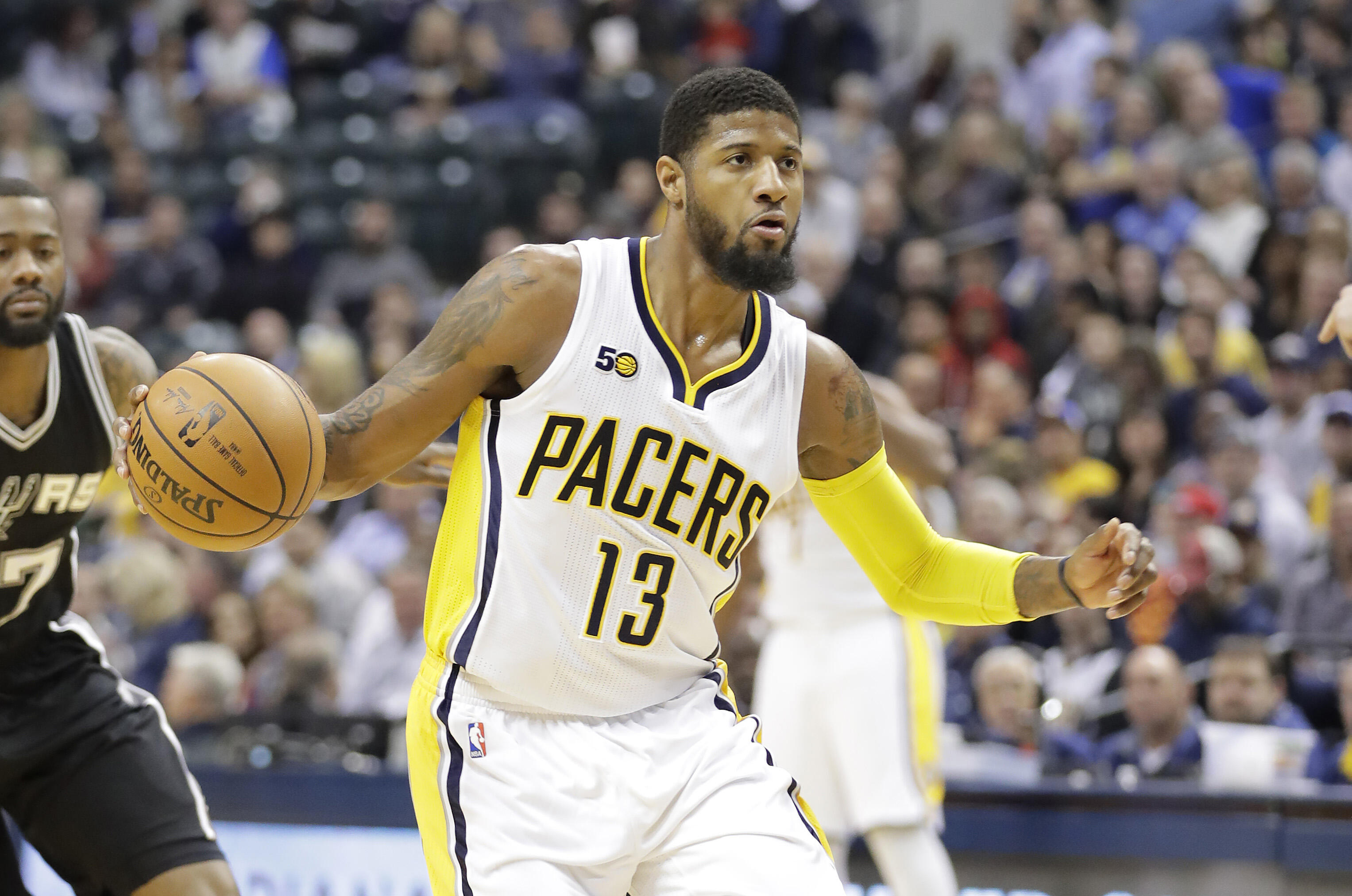 INDIANAPOLIS, IN - FEBRUARY 13:  Paul George #13 of the Indiana Pacers dribbles the ball against the San Antonio Spurs at Bankers Life Fieldhouse on February 13, 2017 in Indianapolis, Indiana.    NOTE TO USER: User expressly acknowledges and agrees that, 