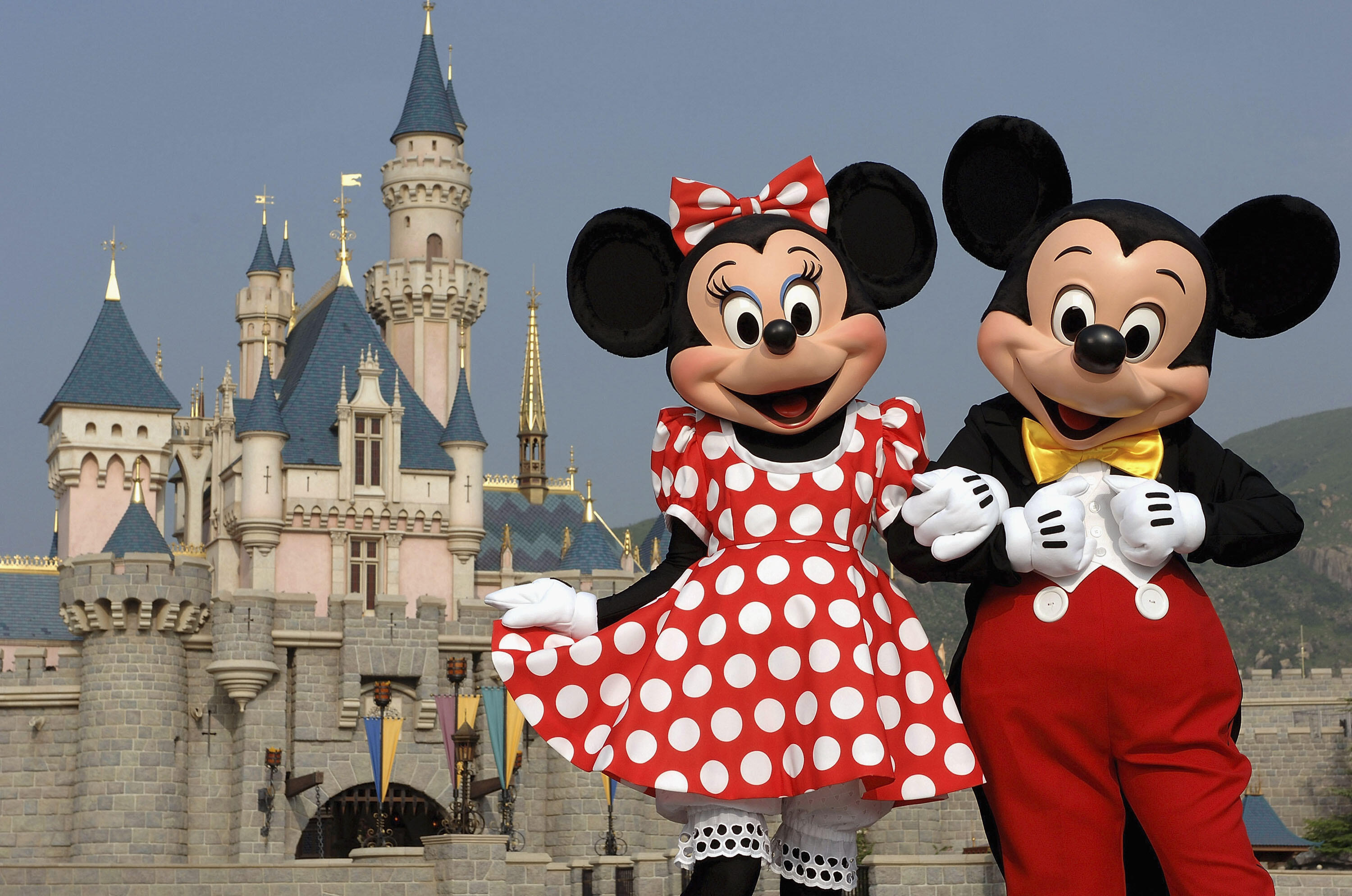 HONG KONG - SEPTEMBER 1: (EDITORIAL USE ONLY)  In this handout photo provided by Disney, Mickey and Minnie Mouse are seen in front of the Sleeping Beauty Castle at the new Disneyland Park on September 1, 2005 in Hong Kong.  The new theme park and vacation