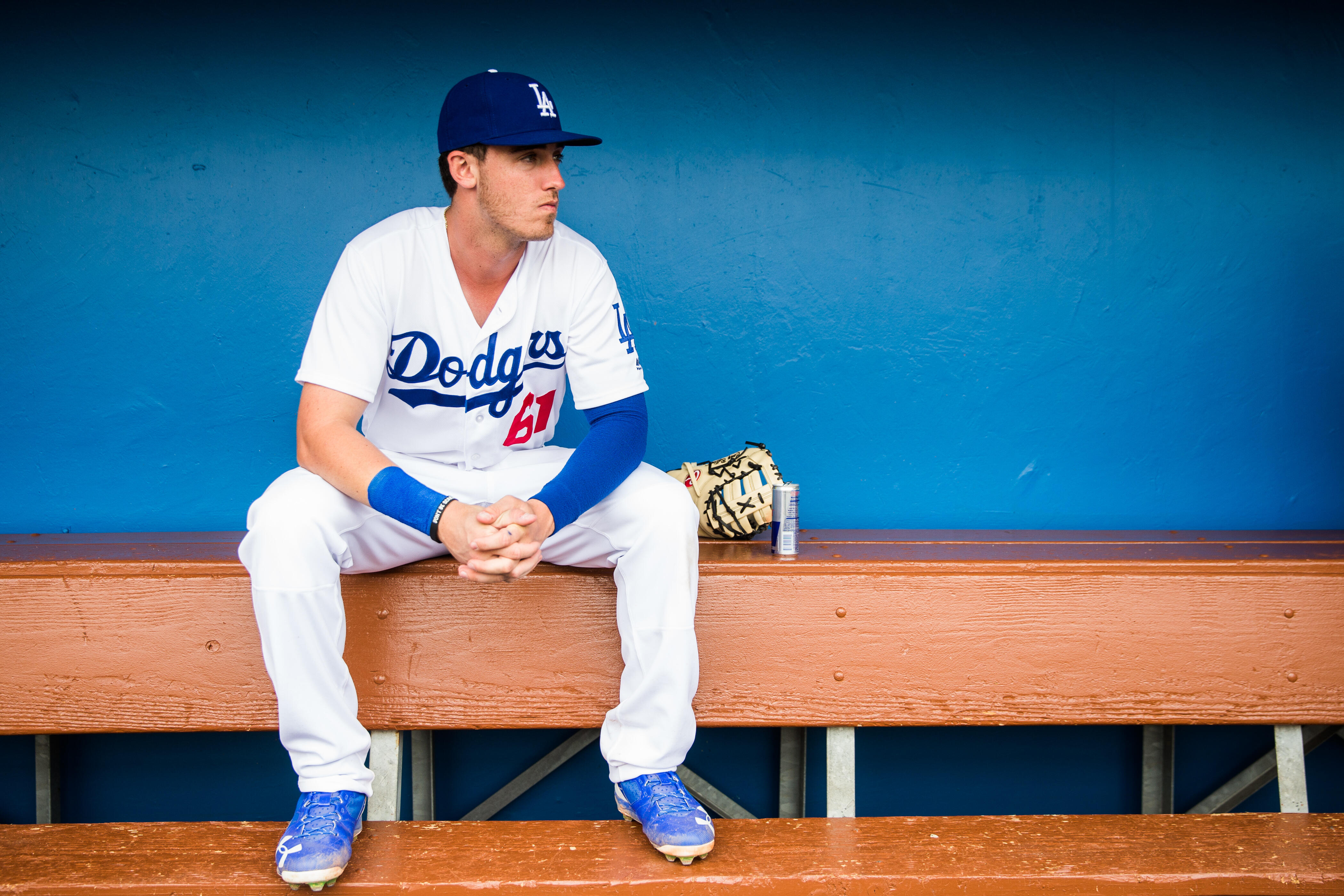 GLENDALE, AZ - FEBRUARY 27:  Cody Bellinger #61 of the Los Angeles Dodgers sits in the dugout before a spring training game against the Colorado Rockies at Camelback Ranch on February 27, 2017 in Glendale, Arizona. (Photo by Rob Tringali/Getty Images)