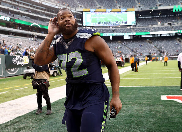 EAST RUTHERFORD, NJ - OCTOBER 02:   Michael Bennett #72 of the Seattle Seahawks listens to the screaming fans as he exits the field after the game against the New York Jets at MetLife Stadium on October 2, 2016 in East Rutherford, New Jersey.  (Photo by Elsa/Getty Images)