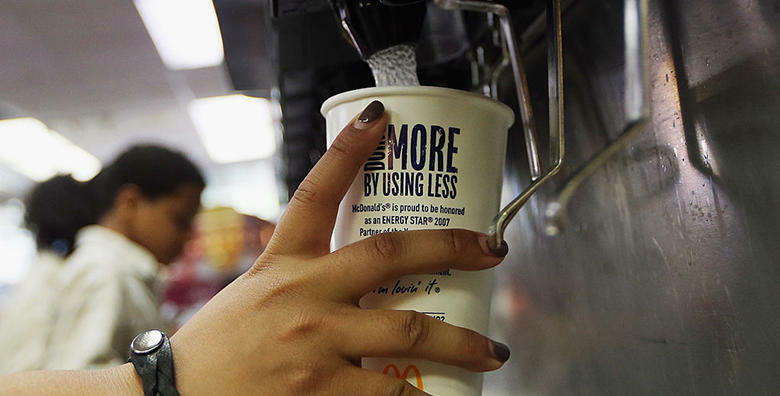 NEW YORK, NY - SEPTEMBER 13: A customer fills a 21 ounce cup with soda at a 'McDonalds' on September 13, 2012 in New York City. In an effort to combat obesity, the New York City Board of Health voted to ban the sale of large sugary drinks. The controversi