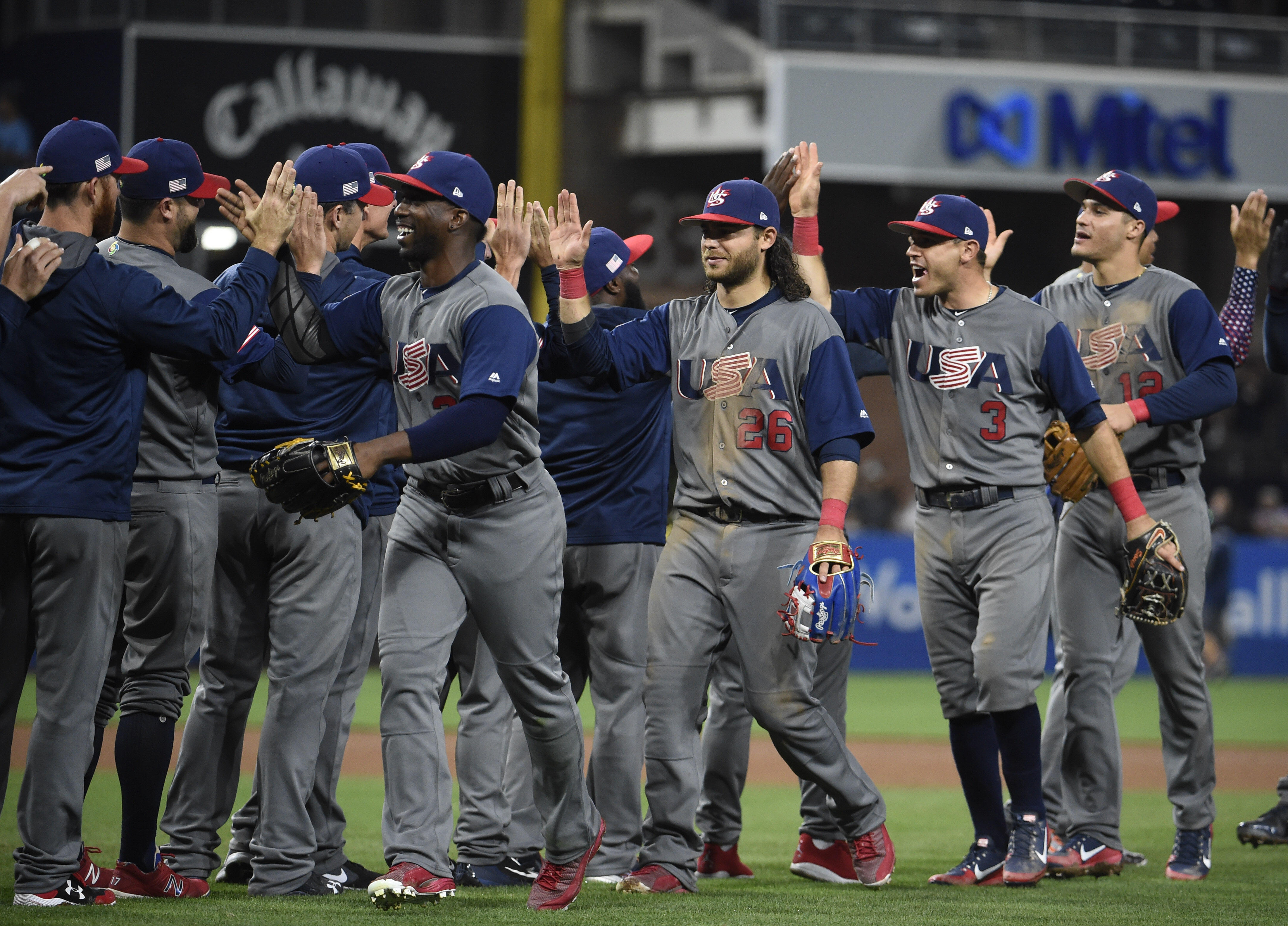 SAN DIEGO, CA - MARCH 18: United States players celebrate after beating the Dominican Republic 6-3 in World Baseball Classic Pool F Game Six at PETCO Park on March 18, 2017 in San Diego, California.  (Photo by Denis Poroy/Getty Images)