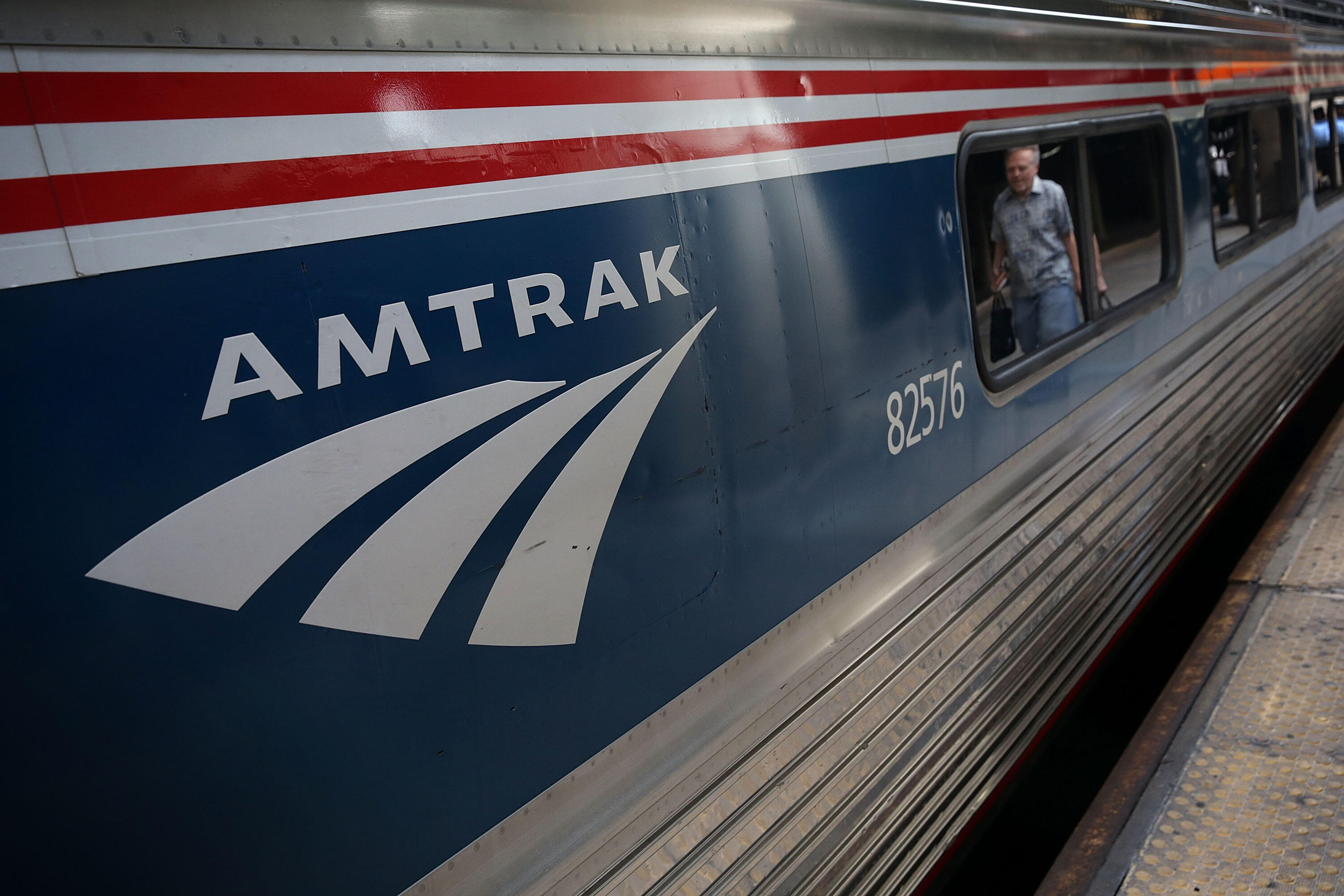 WASHINGTON, DC - SEPTEMBER 03:  A passenger passes by an Amtrak train September 3, 2015 at Union Station in Washington, DC. U.S. Secretary of Homeland Security Jeh Johnson held a press availability to discuss Operation Railsafe.  (Photo by Alex Wong/Getty