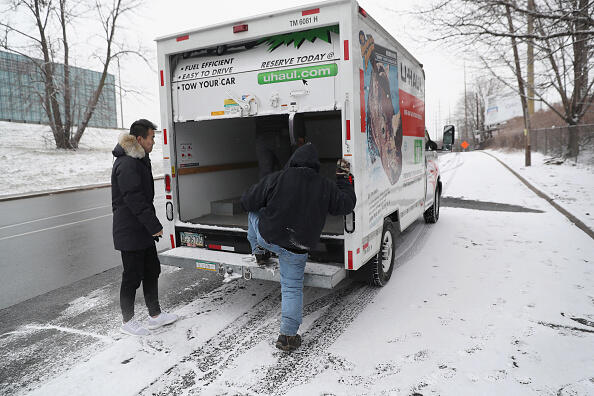 STAMFORD, CT - JANUARY 31:  An employer opens the back door of a U-Haul truck while picking up immigrants at a day labor site on January 31, 2017 in Stamford, Connecticut. The city of Stamford has an official zone for employers to pick up day laborers, although many prefer to stand by nearby businesses or under bridges for warmth. The site is a common place for undocumented immigrants to seek work.   (Photo by John Moore/Getty Images)