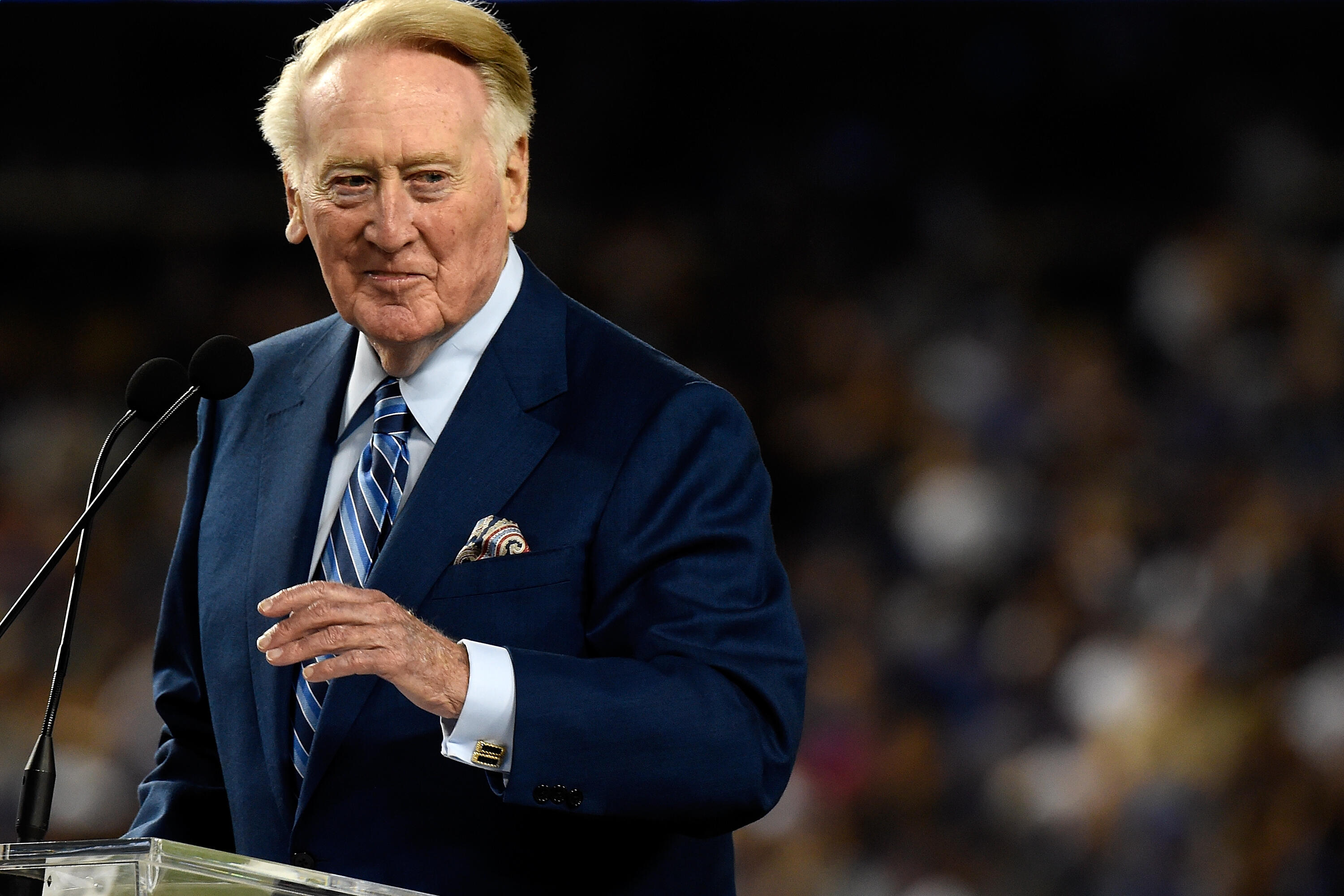 LOS ANGELES, CA - SEPTEMBER 23:  Dodgers announcer Vin Scully addresses the crowd during a retirement ceremony in his honor before the game at Dodger Stadium on September 23, 2016 in Los Angeles, California. Scully is retiring after 67 years with the Dodg