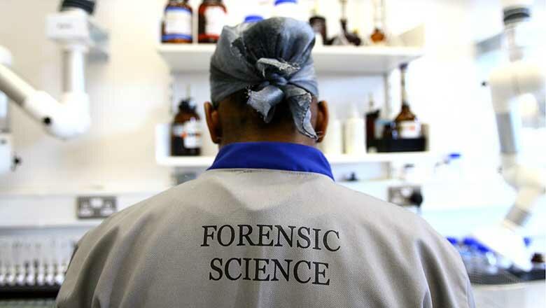 LONDON - JULY 10:  A forensic scientist is seen at work during a media open day at the UK Sport Drug Control Centre at King's College on July 10, 2008 in London, England.  (Photo by Paul Gilham/Getty Images)