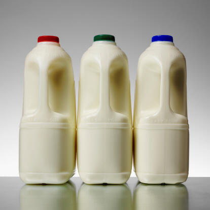 Three milk bottles indoors on table