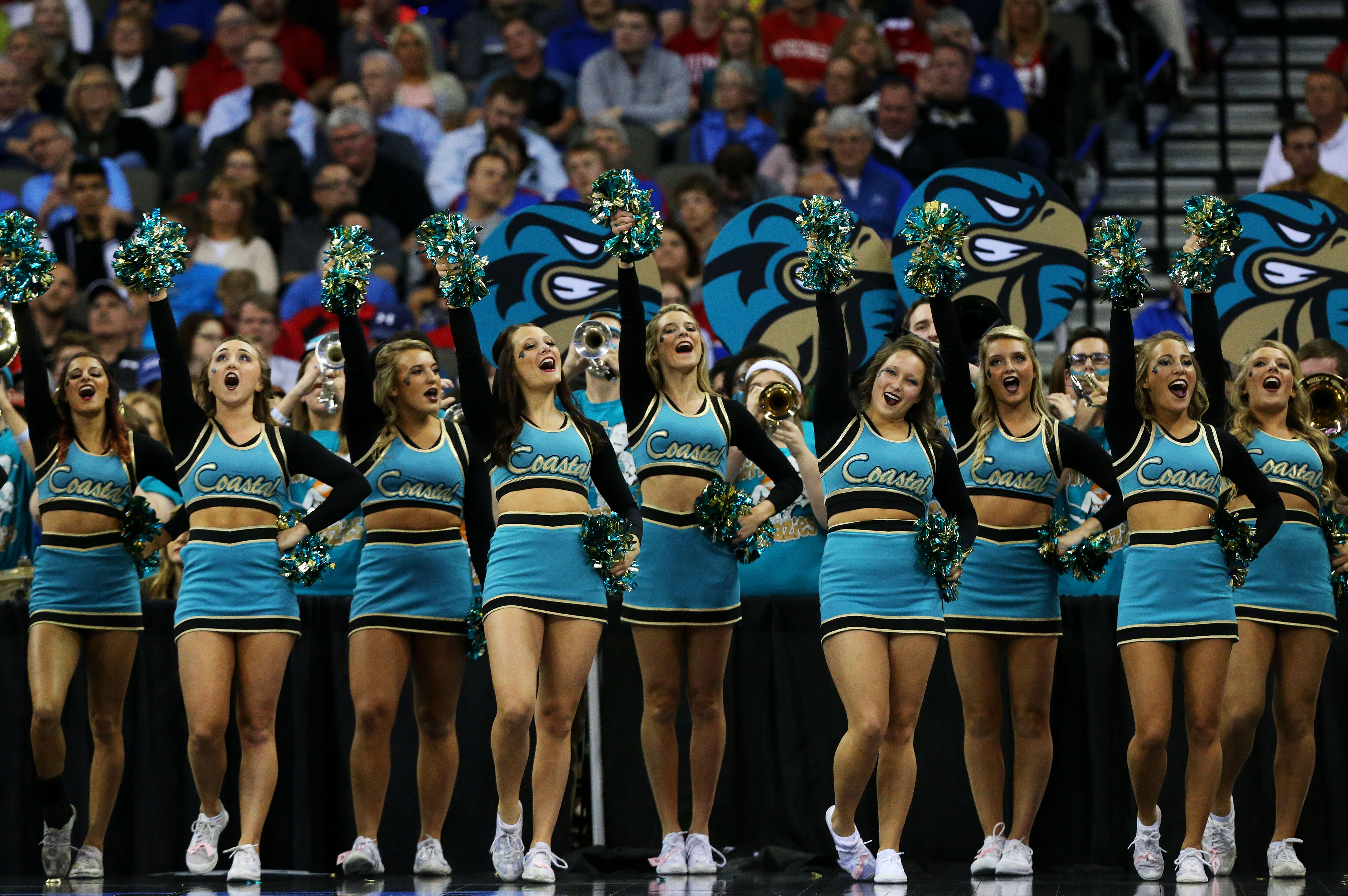 OMAHA, NE - MARCH 20:  Coastal Carolina Chanticleers cheerleaders perform in the first half against the Wisconsin Badgers during the second round of the 2015 NCAA Men's Basketball Tournament at the CenturyLink Center on March 20, 2015 in Omaha, Nebraska. 
