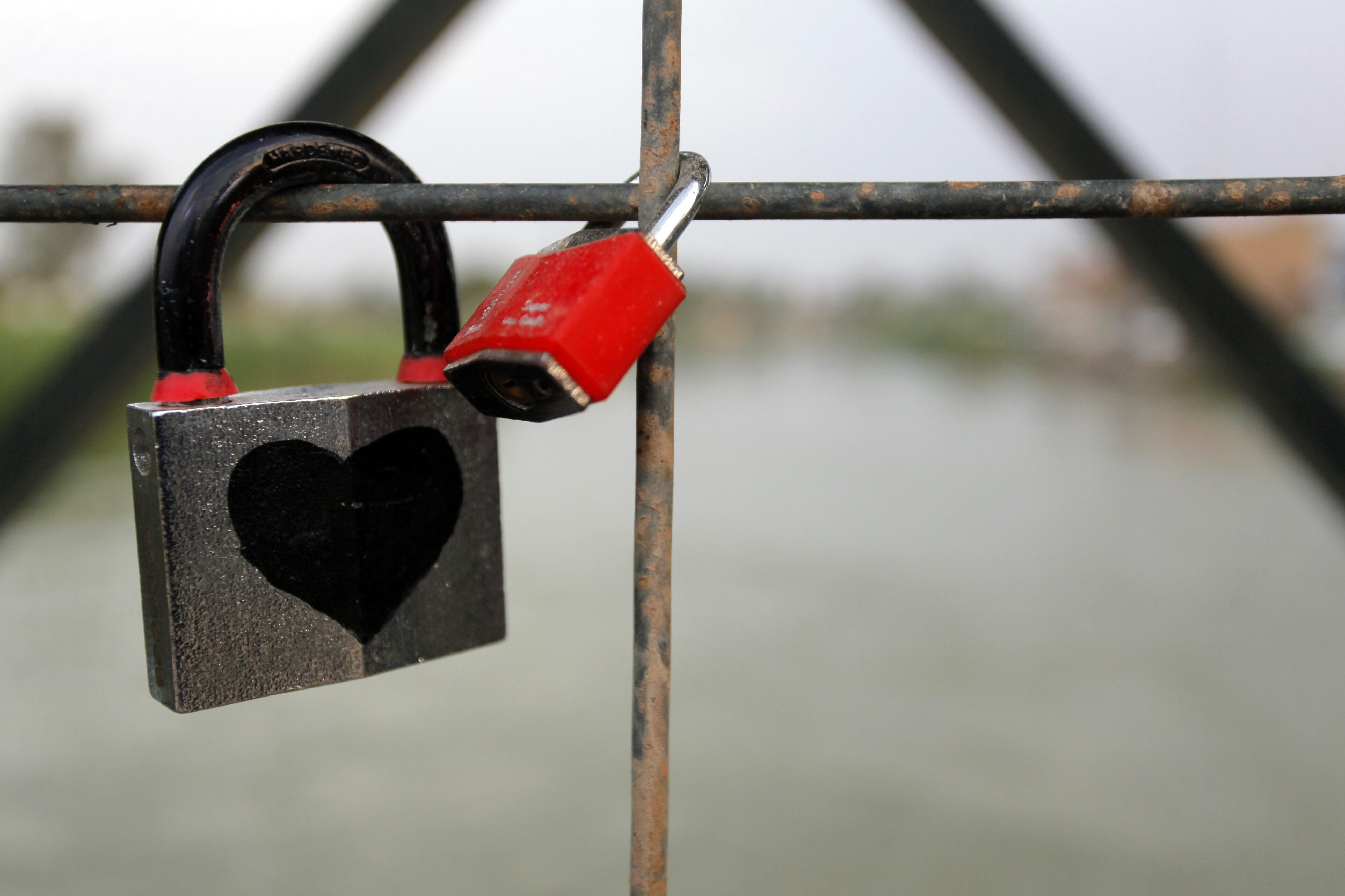 A picture taken on October 14, 2014 shows love padlocks attached to the railing of a bridge in the city of Hillah, the confessionally-mixed but mostly-Shiite capital of Babil province south of Baghdad. The initiative, copying the one on the Pont des Arts 