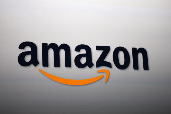 SANTA MONICA, CA - SEPTEMBER 6:  The Amazon logo is projected onto a screen at a press conference on September 6, 2012 in Santa Monica, California.  Amazon unveiled the Kindle Paperwhite and the Kindle Fire HD in 7 and 8.9-inch sizes. (Photo by David McNe