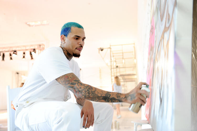 MIAMI, FL - FEBRUARY 12:  Chris Brown paints at SPACEBY3 during Fine Art Auctions Miami's Urban Art Week on February 12, 2015 in Miami, Florida.  (Photo by Sergi Alexander/Getty Images for Fine Art Auctions Miami)
