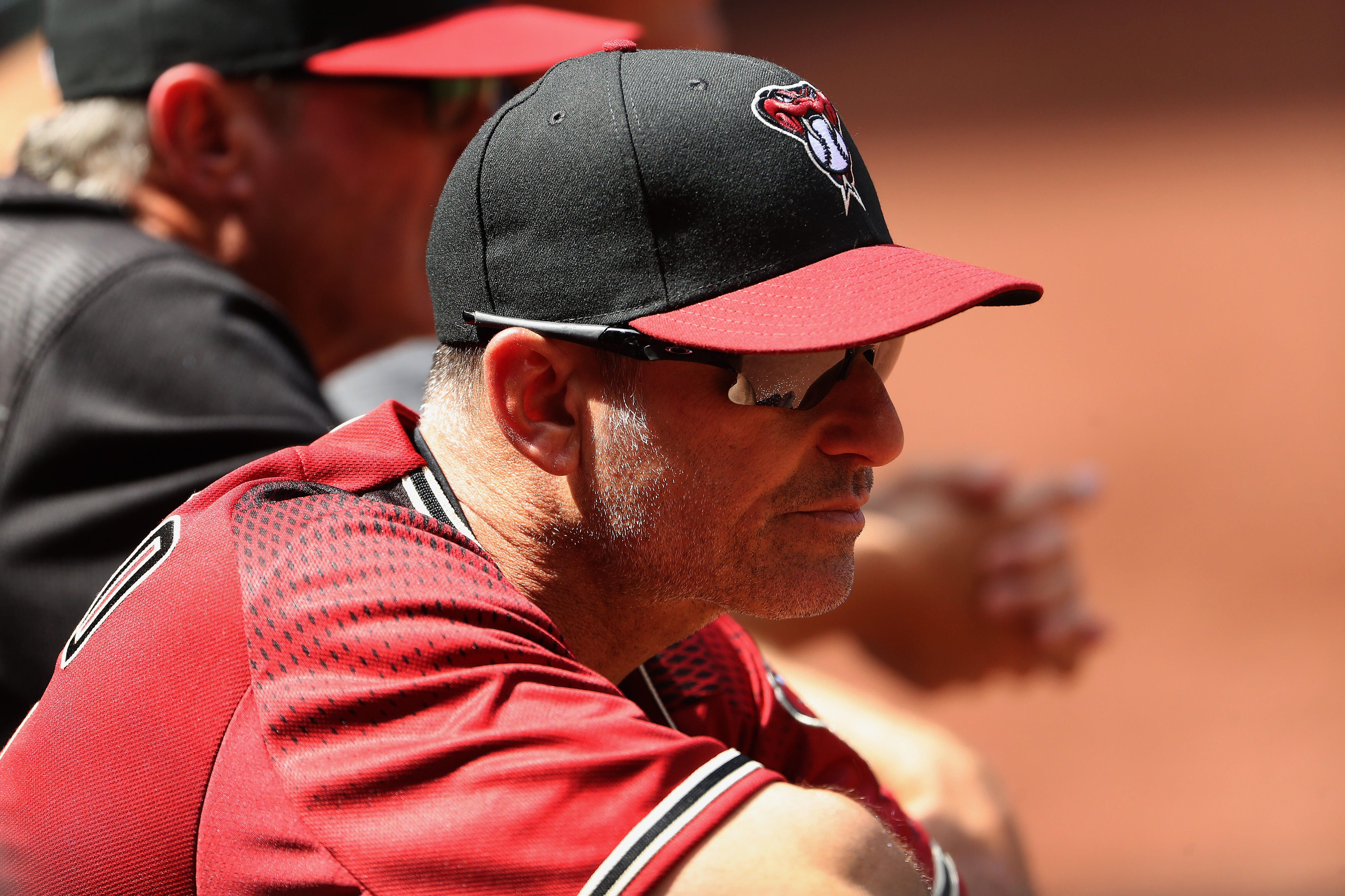 PHOENIX, AZ - APRIL 09:  Manager Torey Lovullo #17 of the Arizona Diamondbacks watches from the dugout during the fourth inning of the MLB game against the Cleveland Indians at Chase Field on April 9, 2017 in Phoenix, Arizona.  (Photo by Christian Peterse
