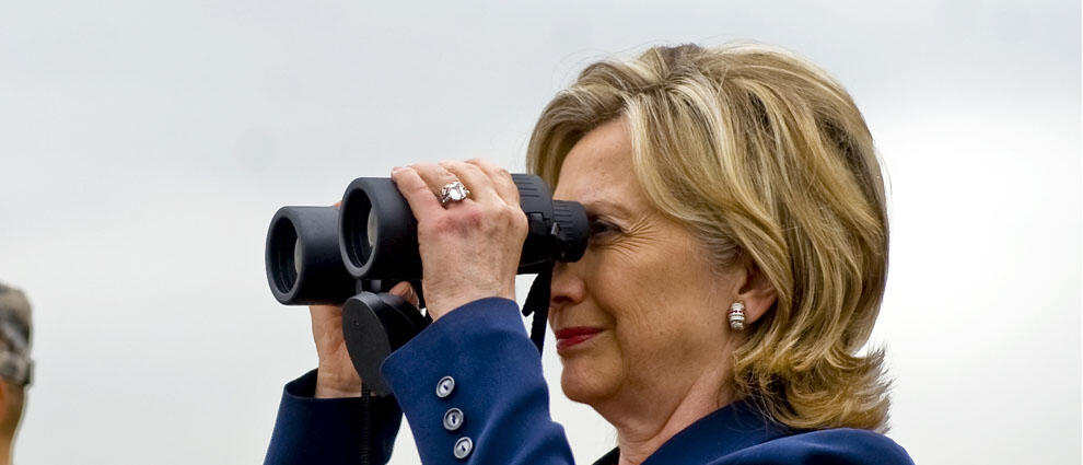 PANMUNJON, SOUTH KOREA - JULY 21:  In this handout from the U.S. Department of Defense (DOD), U.S. Secretary of State Hillary Clinton (R) and U.S. Secretary of Defense Robert Gates look through binoculars over to North Korea during a visit to observation 