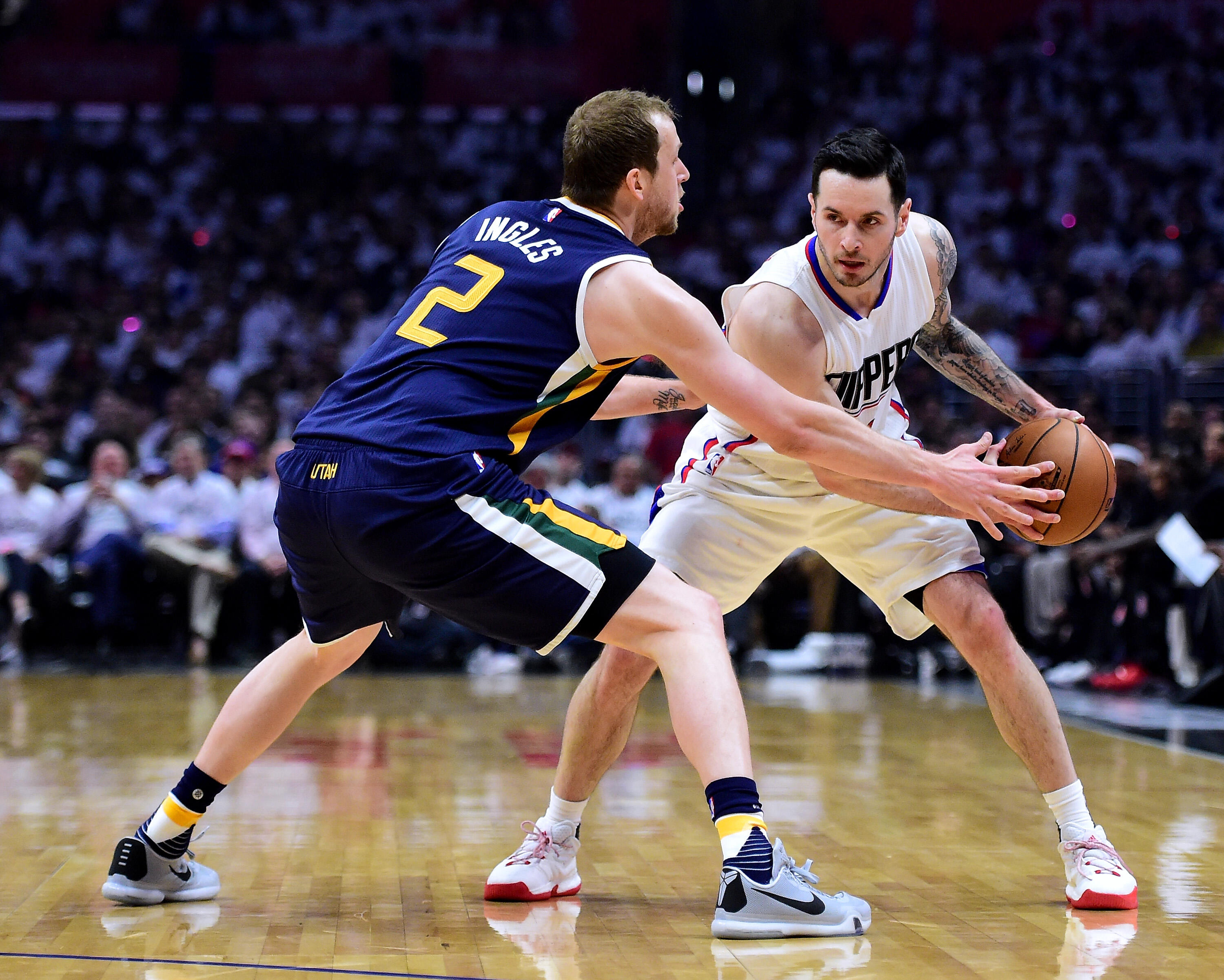 LOS ANGELES, CA - APRIL 15:  JJ Redick #4 of the LA Clippers is guarded by Joe Ingles #2 of the Utah Jazz during a 97-95 Jazz win during the first half at Staples Center on April 15, 2017 in Los Angeles, California.  NOTE TO USER: User expressly acknowled