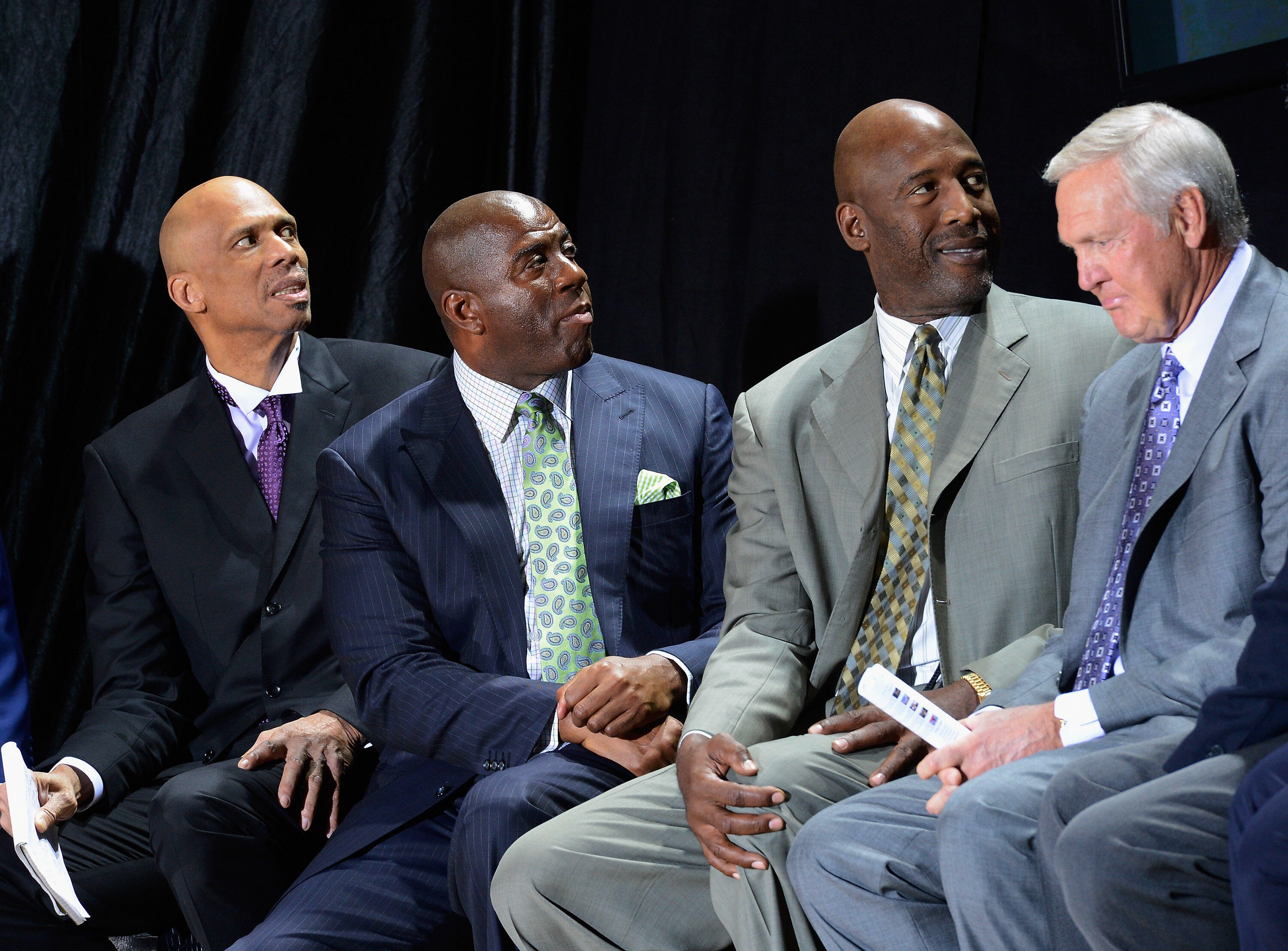 LOS ANGELES, CA - NOVEMBER 16:  Los Angeles Lakers legend Kareem Abdul-Jabbar (L) and his former teammates Earvin 