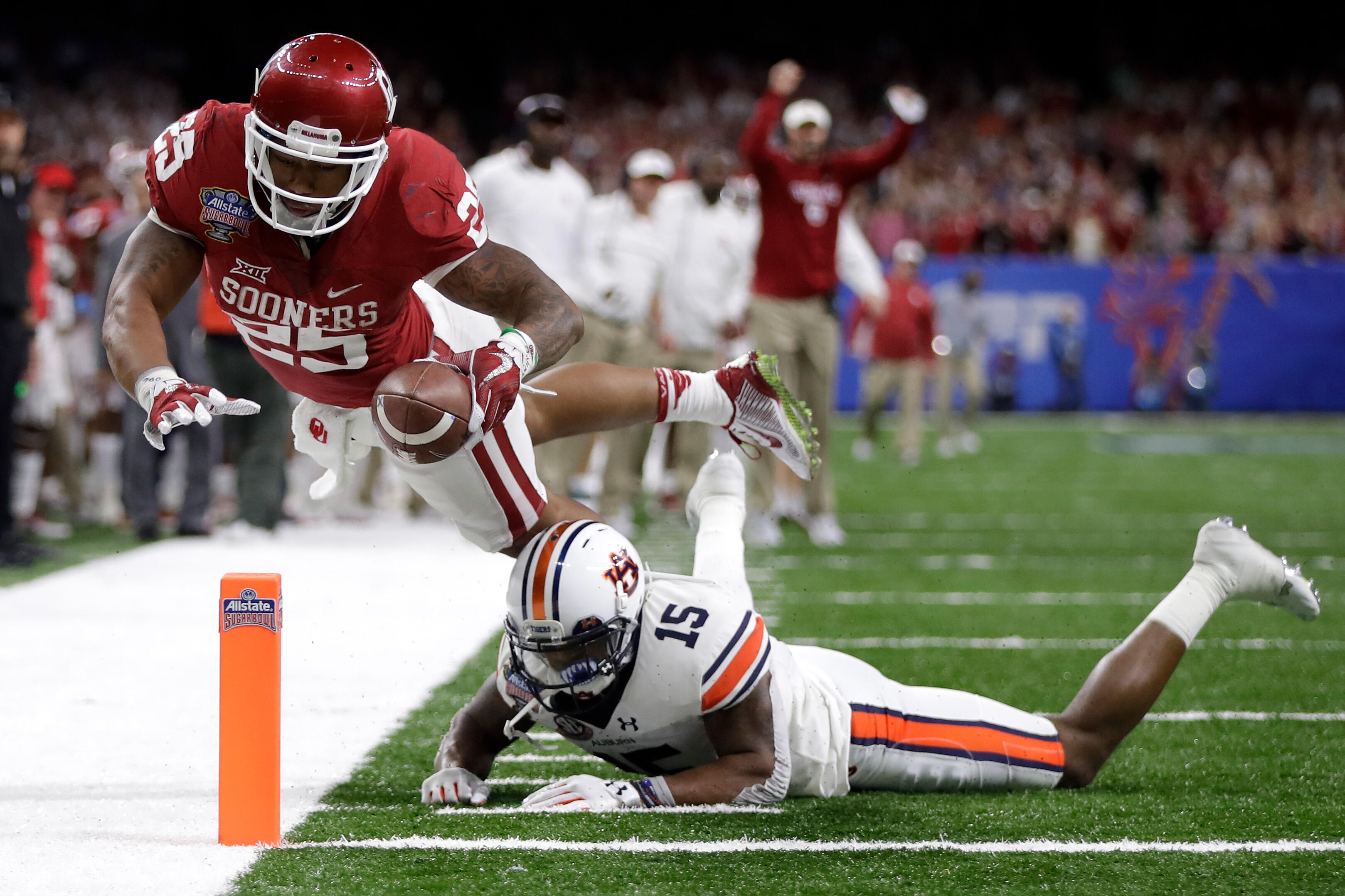 NEW ORLEANS, LA - JANUARY 02:  Joe Mixon #25 of the Oklahoma Sooners scores a touchdown over Joshua Holsey #15 of the Auburn Tigers during the Allstate Sugar Bowl at the Mercedes-Benz Superdome on January 2, 2017 in New Orleans, Louisiana.  (Photo by Sean