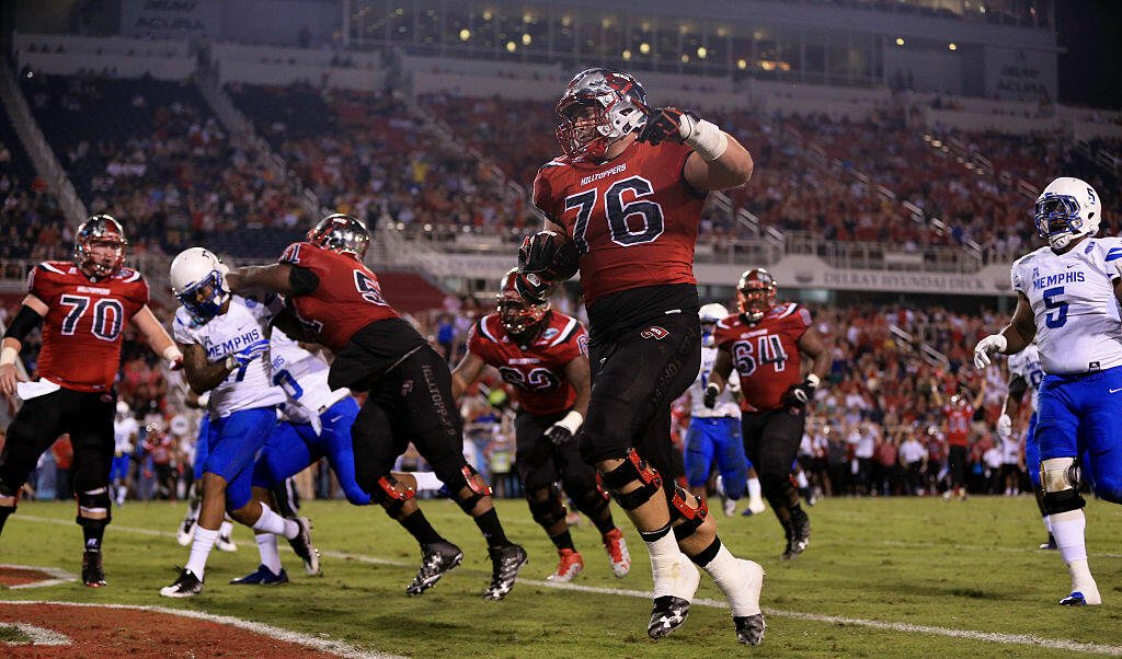 BOCA RATON, FL - DECEMBER 20: Forrest Lamp #76 of the Western Kentucky Hilltoppers scores a touchdown during the first half of the game against the Memphis Tigers at FAU Stadium on December 20, 2016 in Boca Raton, Florida. (Photo by Rob Foldy/Getty Images)