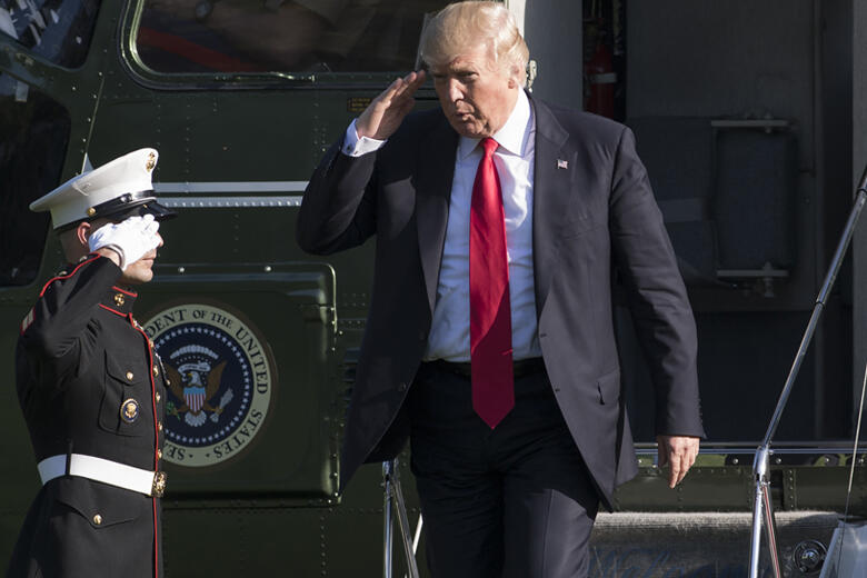 US President Donald Trump walks after arriving on Marine One on the South Lawn of the White House in Washington, DC, April 28, 2017, following a trip to Atlanta, Georgia. / AFP PHOTO / SAUL LOEB        (Photo credit should read SAUL LOEB/AFP/Getty Images)