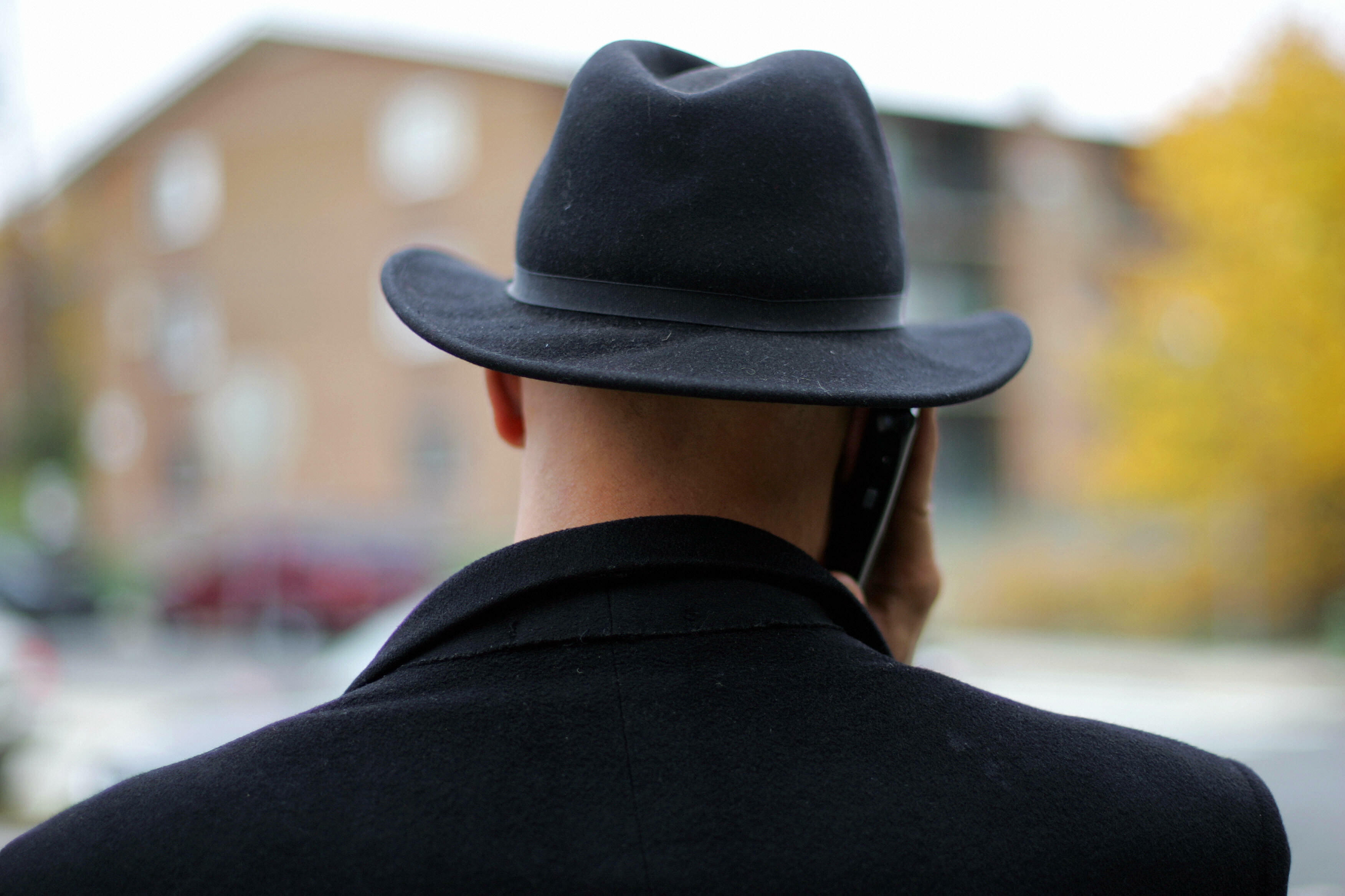 Washington, UNITED STATES:  District of Columbia Council Member and soon to be Mayor Elect Adrian Fenty makes a cell phone call while wearing his trademark fedora hat while visiting polling precincts 07 November, 2006 at Nalle Elementary School in South E