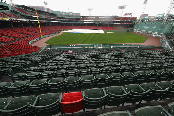 BOSTON, MA - OCTOBER 09:  A red seat marking the spot where Ted Williams hit the longest home run in Fenway Park history is seen as rain falls after game three of the American League Divison Series between the Boston Red Sox and the Cleveland Indians was postponed due to weather at Fenway Park on October 9, 2016 in Boston, Massachusetts.  (Photo by Elsa/Getty Images)
