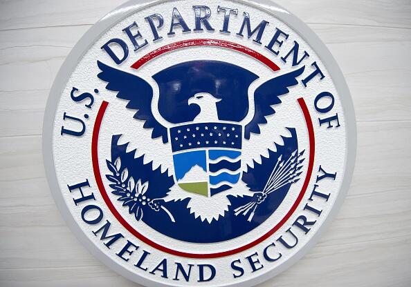 The Department of Homeland Security logo is seen at the new ICE Cyber Crimes Center expanded facilities in Fairfax, Virginia July 22, 2015. The forensic lab combats cybercrime cases involving underground online marketplaces, child exploitation, intellectual property theft and other computer and online crimes.  AFP HOTO/Paul J. Richards        (Photo credit should read PAUL J. RICHARDS/AFP/Getty Images)