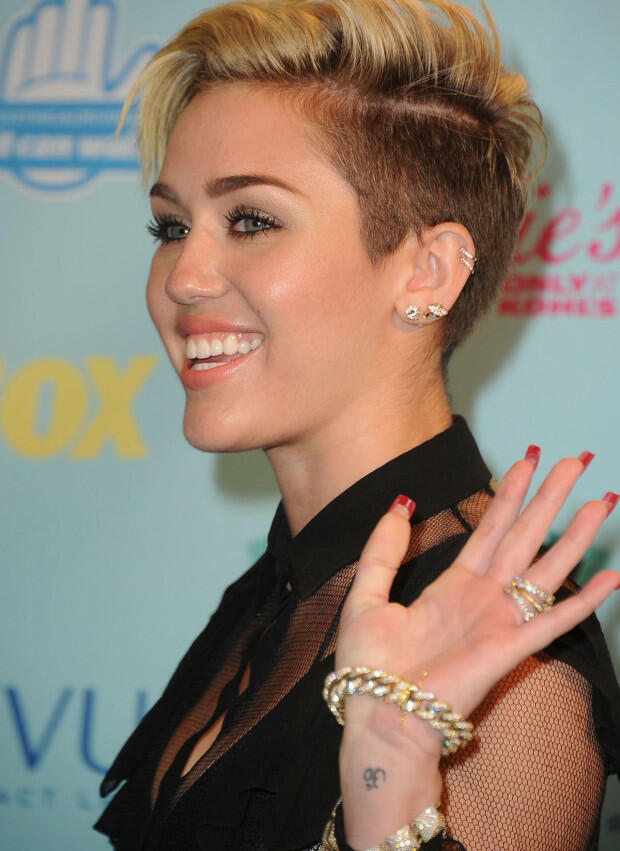 UNIVERSAL CITY, CA - AUGUST 11:  Actress/singer Miley Cyrus poses in the press room at the 2013 Teen Choice Awards at Gibson Amphitheatre on August 11, 2013 in Universal City, California.  (Photo by Steve Granitz/WireImage)