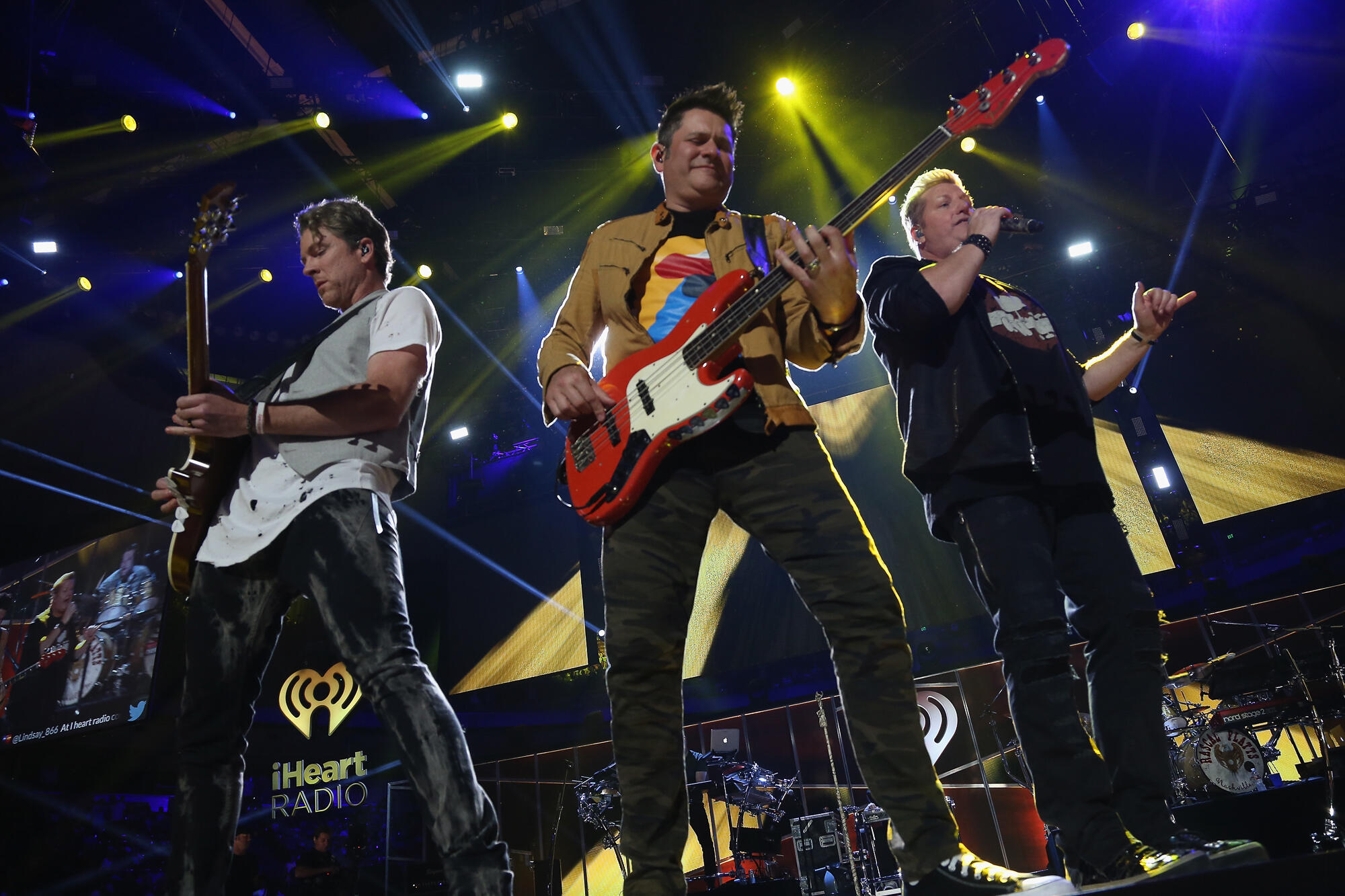 AUSTIN, TX - MAY 06:  Singer Gary LeVox (R) Joe Don Rooney (L) and Jay DeMarcus (C) of Rascal Flatts perform onstage during the 2017 iHeartCountry Festival, A Music Experience by AT&T at The Frank Erwin Center on May 6, 2017 in Austin, Texas.  (Photo by G