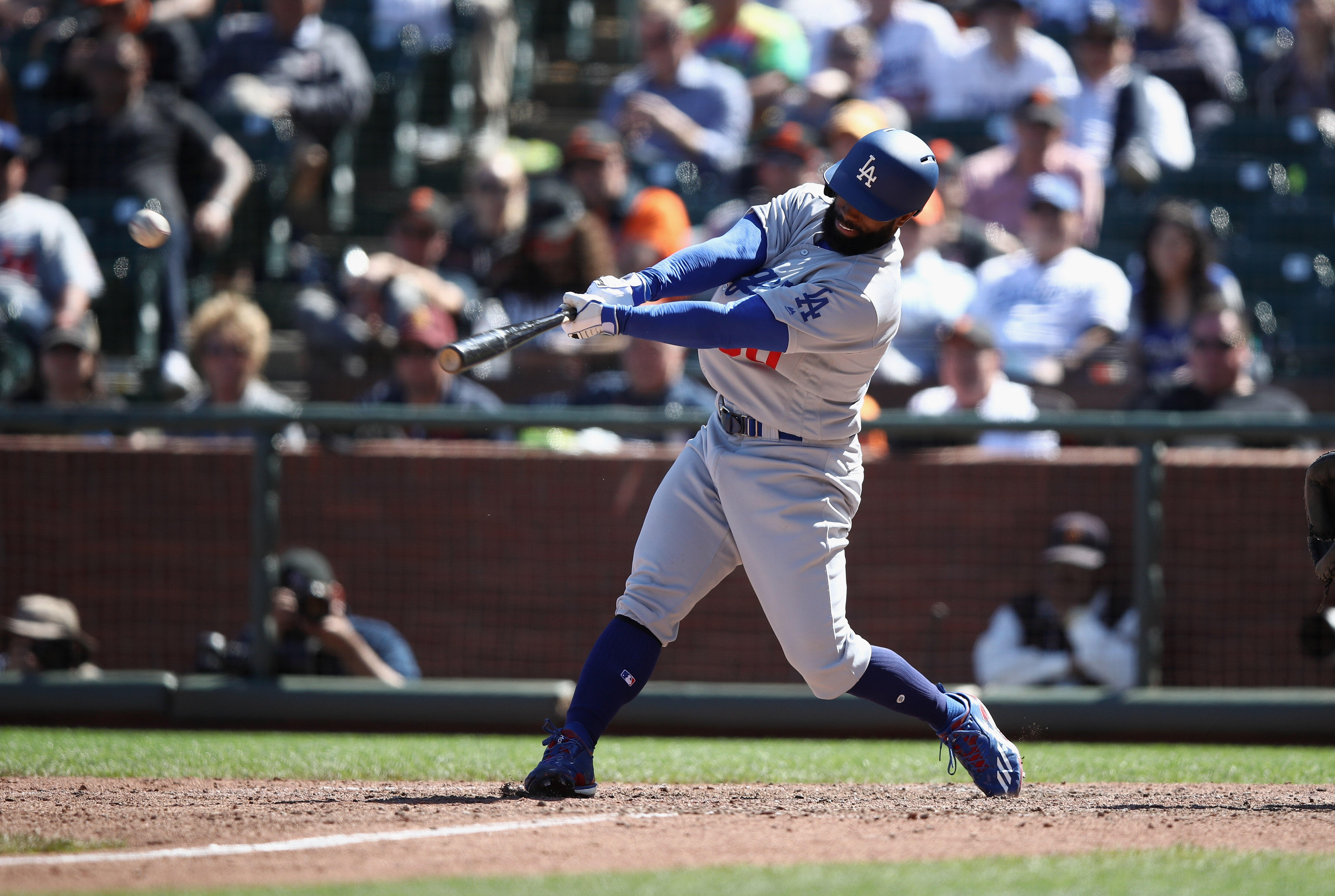 SAN FRANCISCO, CA - APRIL 27:  Andrew Toles #60 of the Los Angeles Dodgers hits a single that scored Ross Stripling #68 in the 10th inning against the San Francisco Giants at AT&T Park on April 27, 2017 in San Francisco, California.  (Photo by Ezra Shaw/G