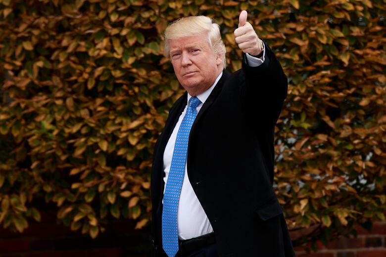 BEDMINSTER TOWNSHIP, NJ - NOVEMBER 20: President-elect Donald Trump waves as he arrives at Trump International Golf Club for a day of meetings, November 20, 2016 in Bedminster Township, New Jersey. Trump and his transition team are in the process of filli