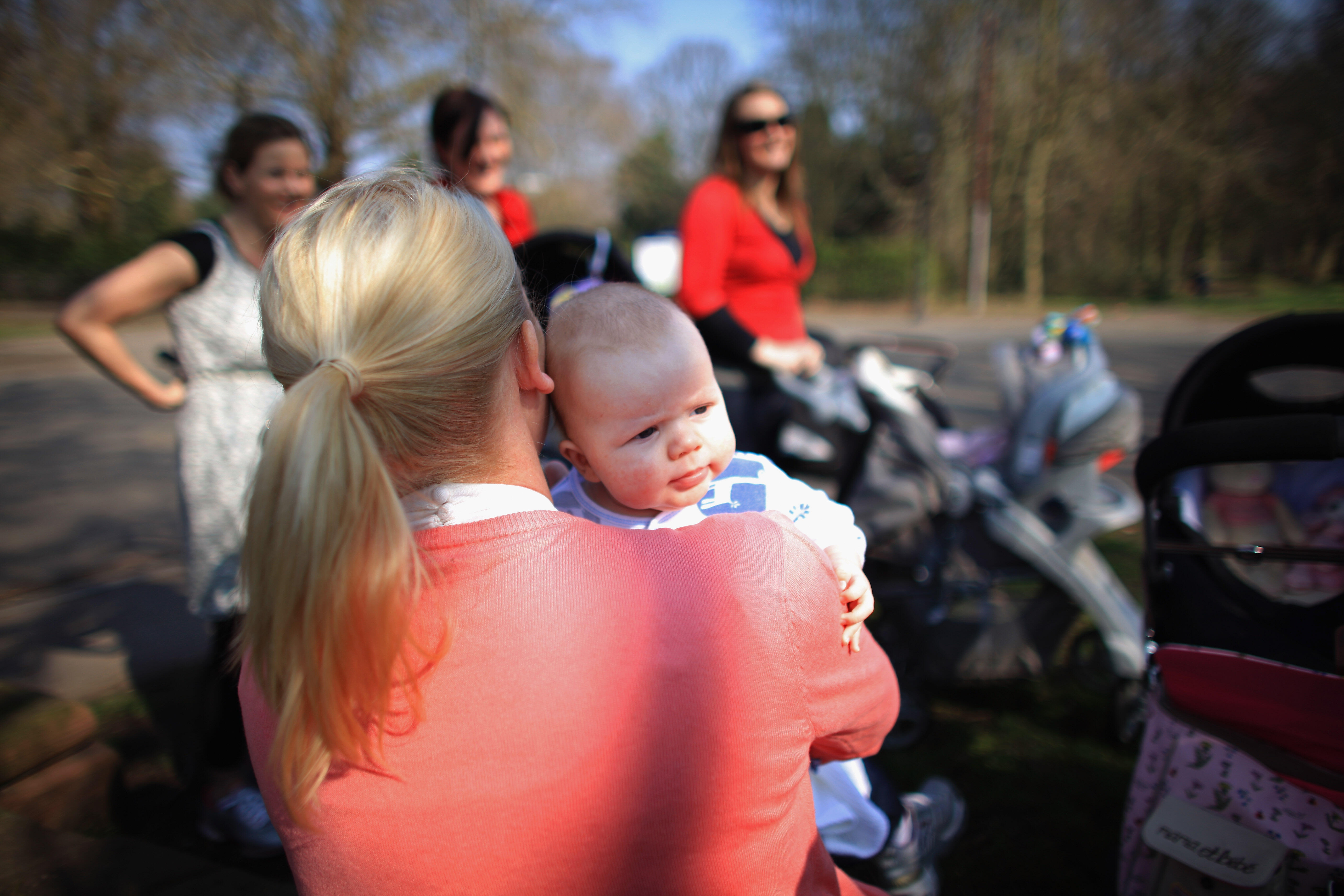 LIVERPOOL, UNITED KINGDOM - MARCH 23:  A group of mothers feed their children in Sefton Park, on the day that Britain's Chancellor George Osbourne delivers his annual budget on March 23, 2011 in Liverpool, United Kingdom. The Chancellor will implement fur