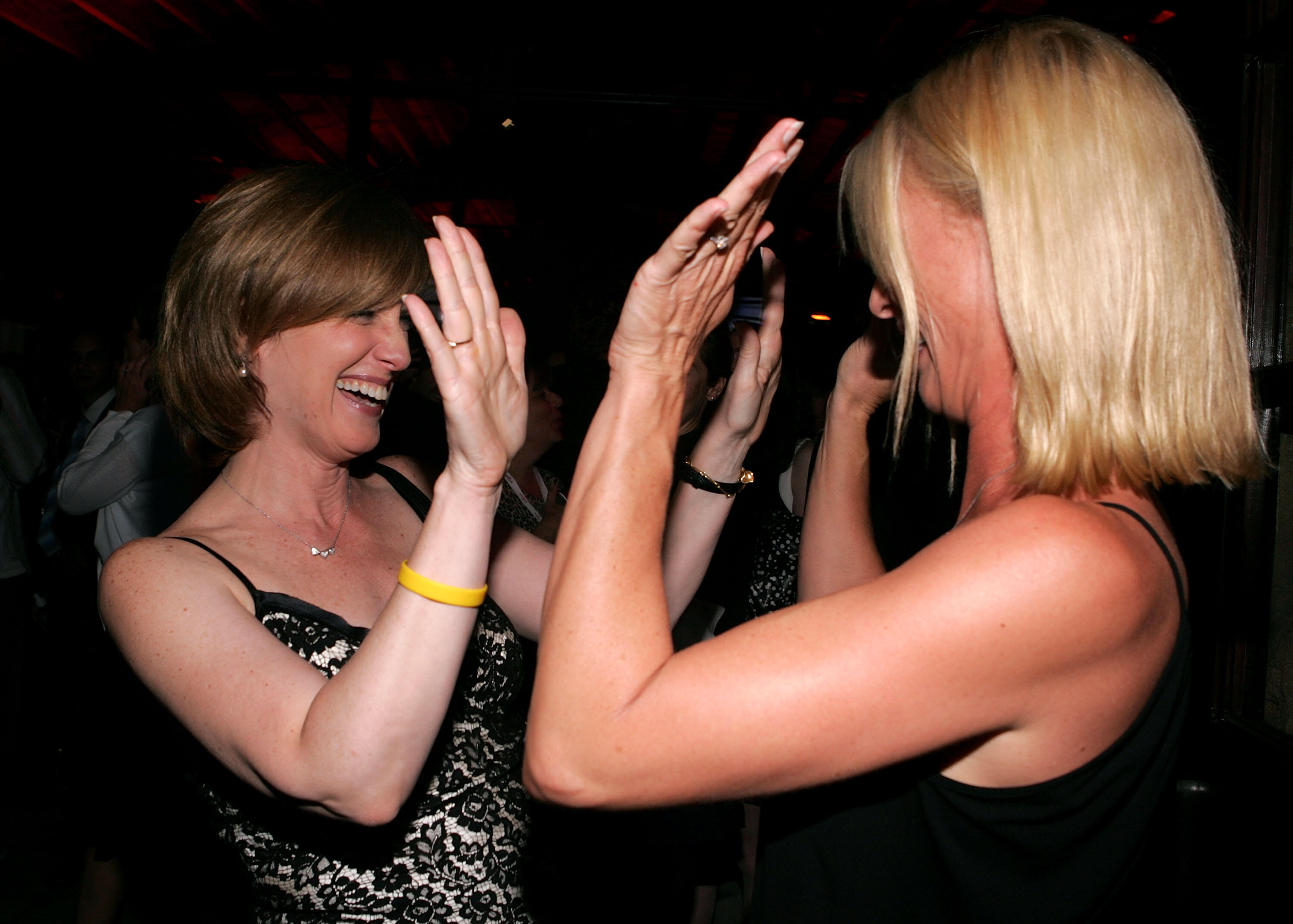 WEST HOLLYWOOD, CA - JULY 27:  Co-Chairman, Disney Media Networks, President, Disney-ABC Television Group Anne Sweeney and actress Nicollette Sheridan high-five inside at the ABC TCA party at the Abby on July 27, 2005 in West Hollywood, California.  (Phot