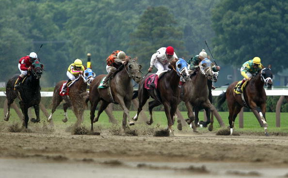 SARATOGA SPRINGS, NEW YORK - JULY 27:  Thoroughbreds race at Saratoga Race Course during opening weekend of the thoroughbred racing season July 27, 2003 in Saratoga Springs, New York. The horse racing industry is hoping that the release of the new movie 