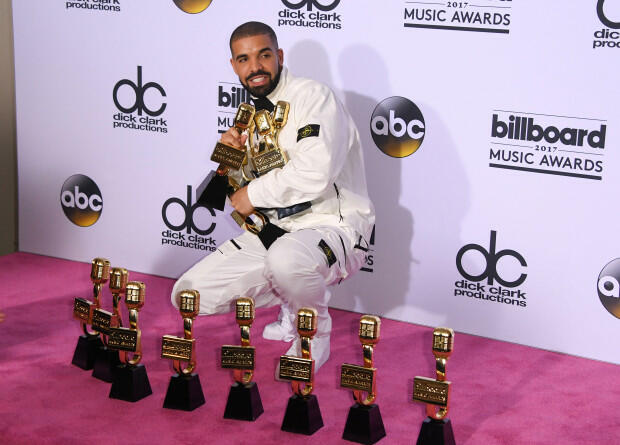 Rapper Drake poses in the press room with his awards during the 2017 Billboard Music Awards at the T-Mobile Arena on May 21, 2017 in Las Vegas, Nevada. Drake won for Top Artist, Top Male Artist, Top Billboard 200 Artist, Top Billboard 200 Album for 'Views