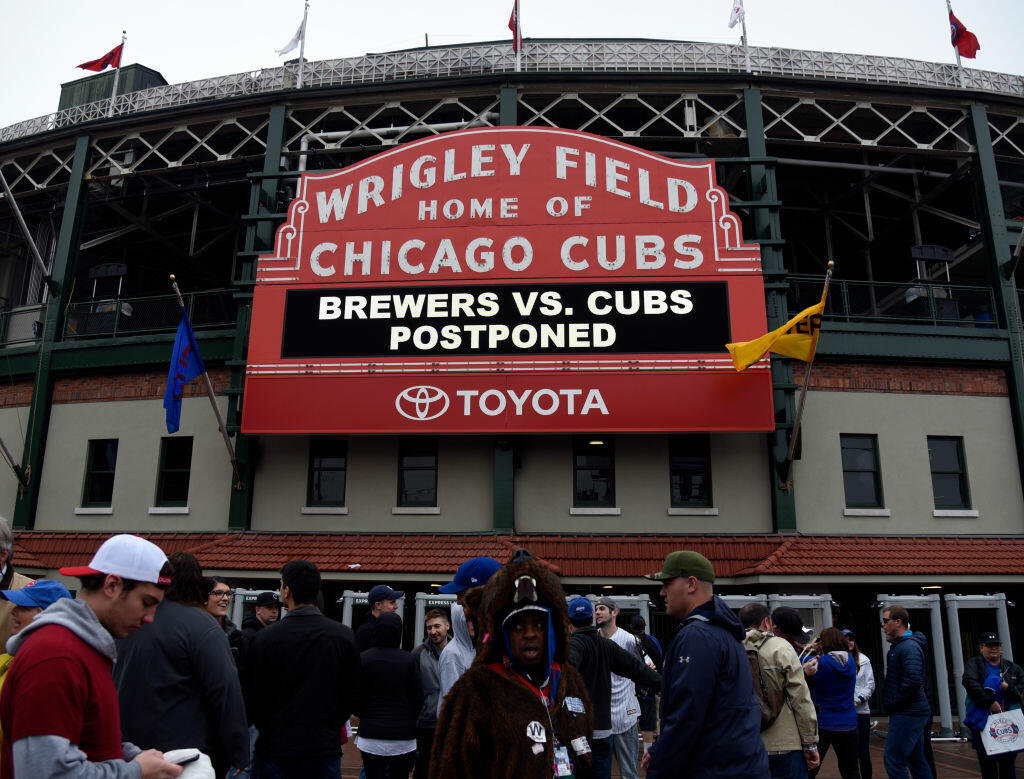 CHICAGO, IL - MAY 20: Fans stand outside the ballpark as the game between the Chicago Cubs and the Milwaukee Brewers was postponed due to weather on May 20, 2017 at Wrigley Field  in Chicago, Illinois. The game is rescheduled to be played July 6th at 1:20 pm.  (Photo by David Banks/Getty Images)