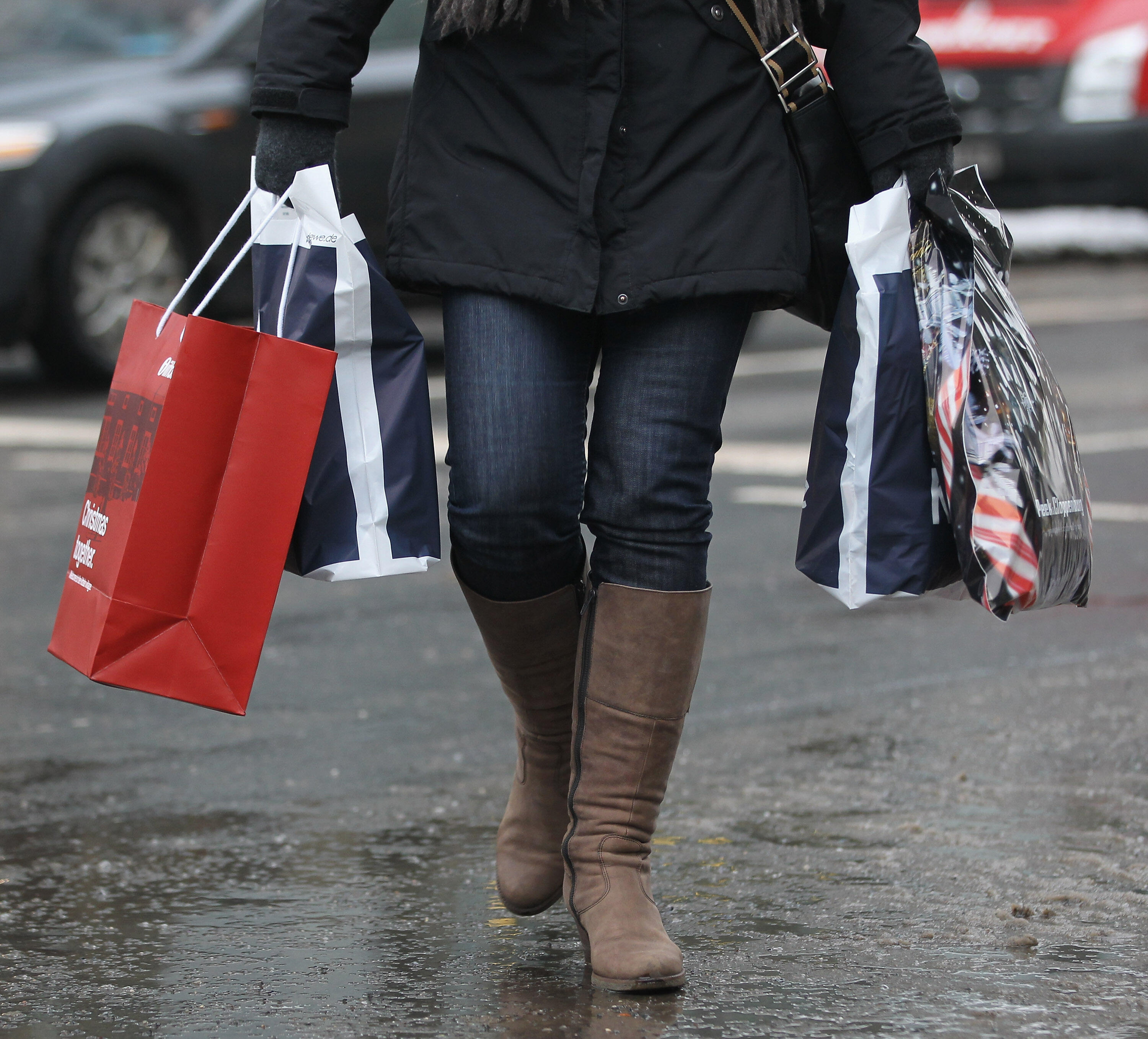 BERLIN, GERMANY - DECEMBER 22:  A woman carries shopping bags two days before Christmas on December 22, 2010 in Berlin, Germany. German retailers have announced strong Christmas sales that are coming on the heels of a robust German economic recovery from 