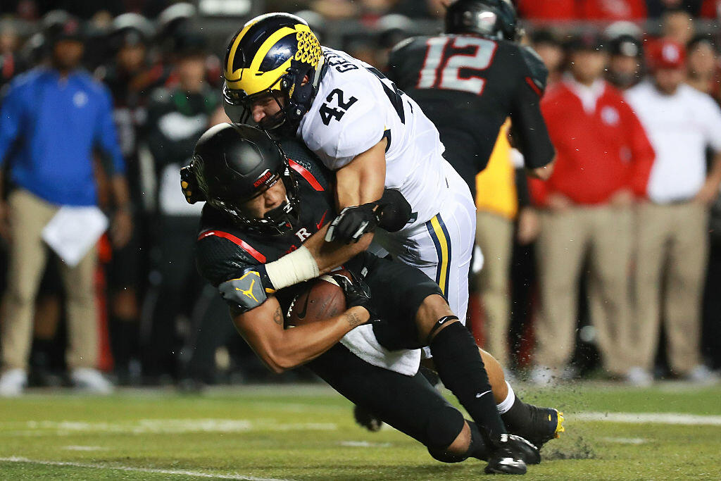 PISCATAWAY, NJ - OCTOBER 08:  Ben Gedeon #42 of the Michigan Wolverines tackles Jawuan Harris #3 of the Rutgers Scarlet Knights during the first half at High Point Solutions Stadium on October 8, 2016 in Piscataway, New Jersey.  (Photo by Michael Reaves/Getty Images)