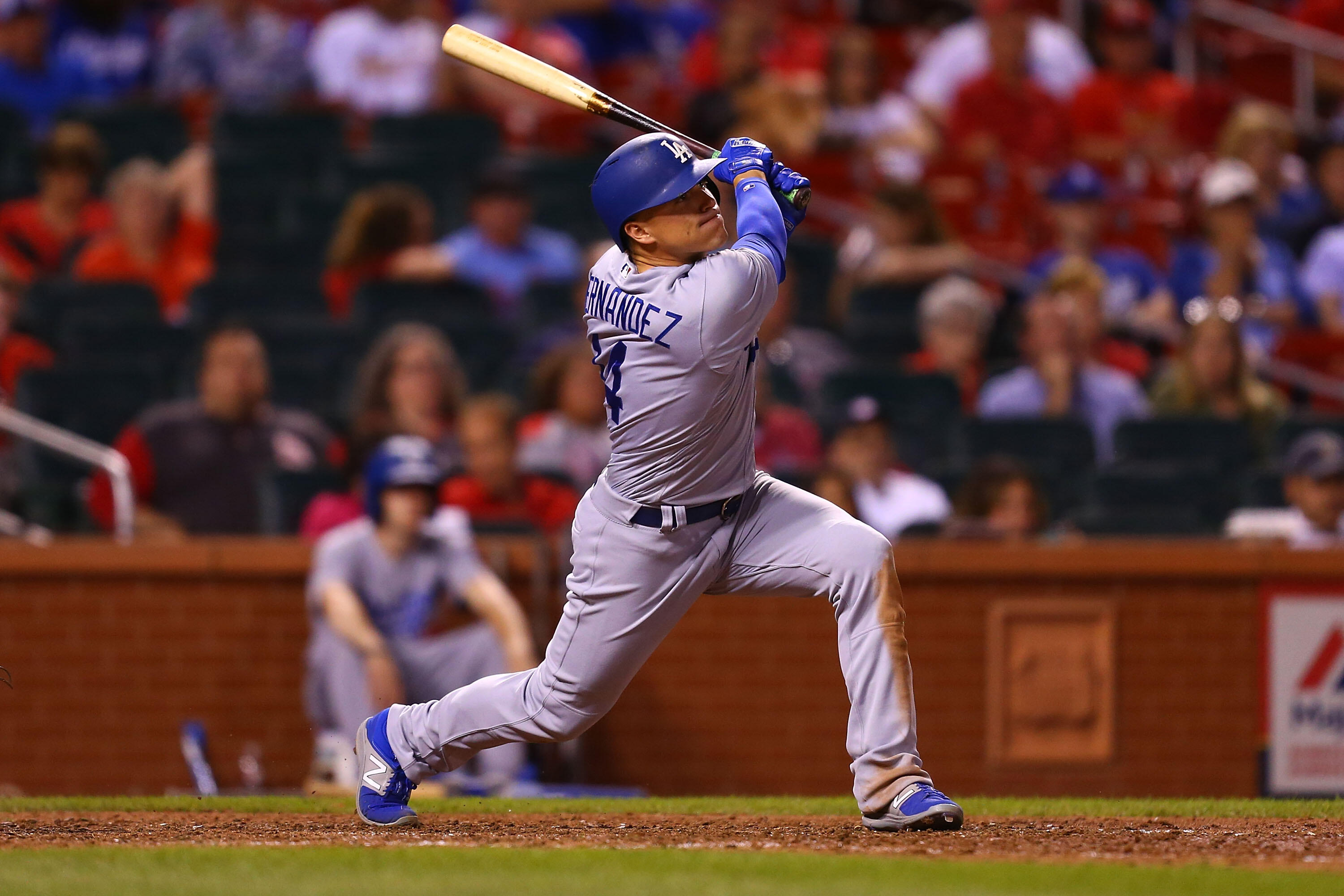 ST. LOUIS, MO - MAY 30: Enrique Hernandez #14 of the Los Angeles Dodgers hits a sacrifice RBI against the St. Louis Cardinals in the ninth inning at Busch Stadium on May 30, 2017 in St. Louis, Missouri.  (Photo by Dilip Vishwanat/Getty Images)
