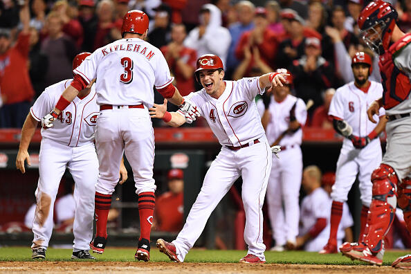 CINCINNATI, OH - JUNE 7:  Scooter Gennett #4 of the Cincinnati Reds celebrates with Patrick Kivlehan #3 of the Cincinnati Reds at home plate after Kivlehan hit a three-run home run in the seventh inning against the St. Louis Cardinals at Great American Ball Park on June 7, 2017 in Cincinnati, Ohio. Cincinnati defeated St. Louis 6-4.  (Photo by Jamie Sabau/Getty Images)