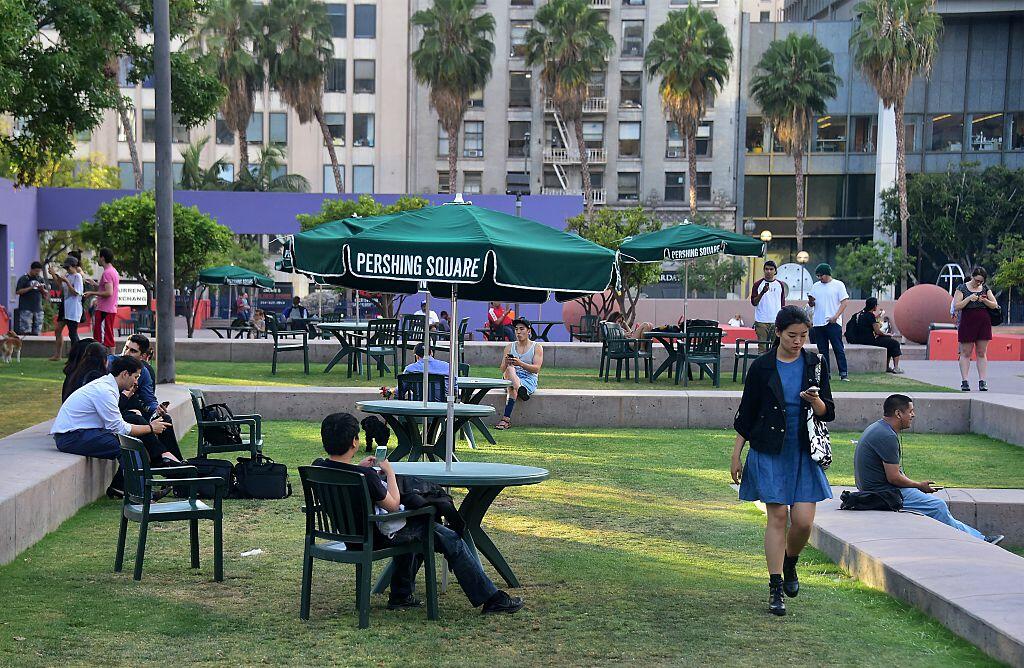 People look at their cellphones while playing Pokemon Go at Pershing Square in Los Angeles, California on July 13, 2016, at just one of many landmark locations across southern California where people are gatering to play the game.  The location-based augmented reality mobile game was released on July 6th. / AFP / Frederic J. BROWN        (Photo credit should read FREDERIC J. BROWN/AFP/Getty Images)